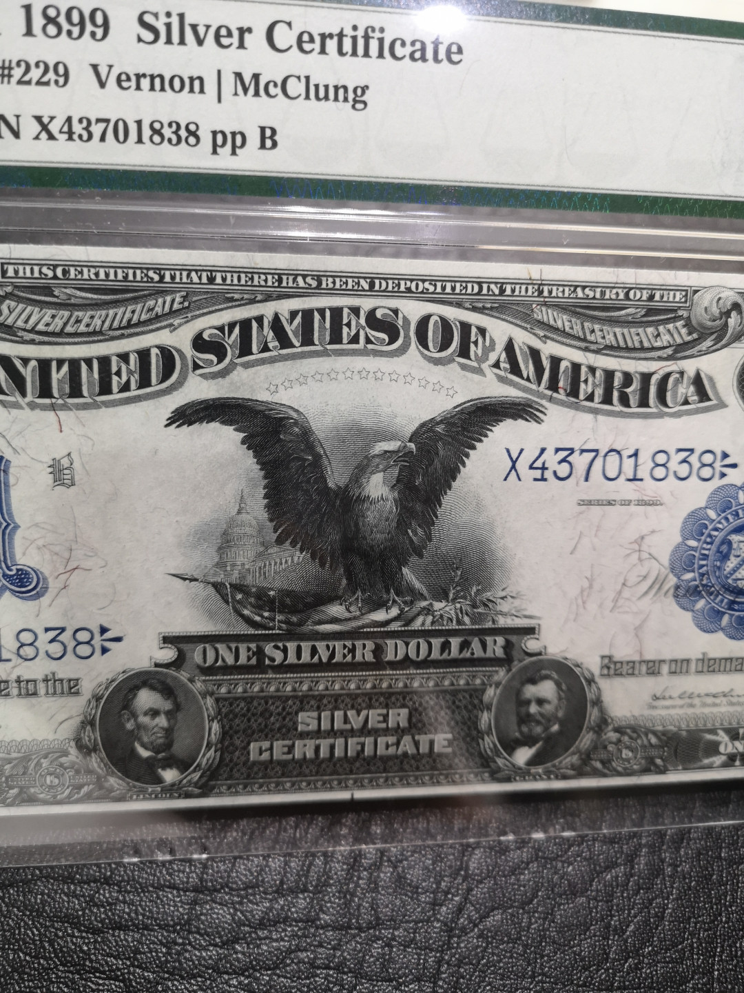 《外钞收藏家》第八十七期拍卖 1899年1美元 黑鹰 老美元收藏 必入品种 无任何瑕疵 pmg66 完美品相 背面浓墨 特殊标签