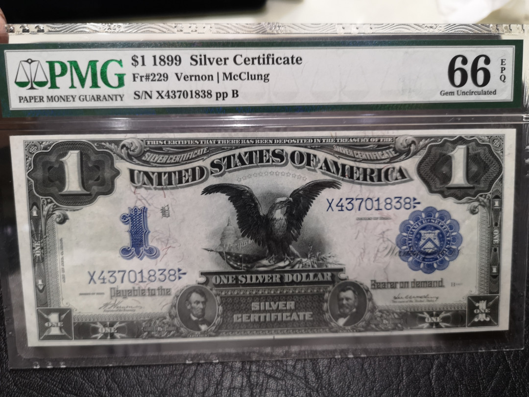 《外钞收藏家》第八十七期拍卖 1899年1美元 黑鹰 老美元收藏 必入品种 无任何瑕疵 pmg66 完美品相 背面浓墨 特殊标签