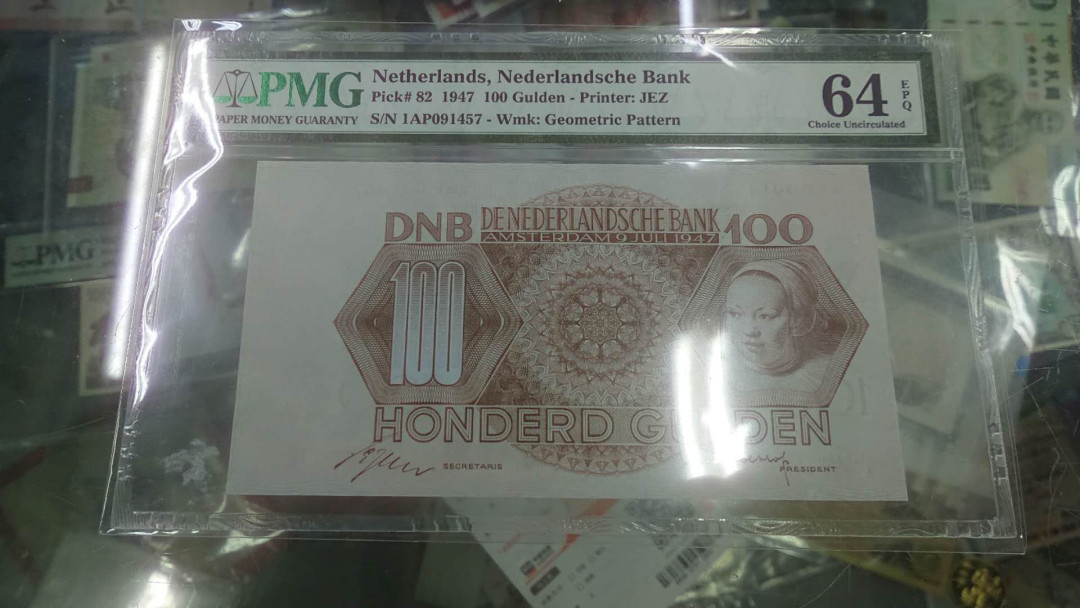 【囧羊收藏】精选微拍第4场~评级币专场（有澳门金龙，荷兰伊拉斯谟等），近期陆续上架 1947年荷兰100盾 PMG64E（居中偏离明显所致，裸币本身无任何毛病，超值。65就2000多了）