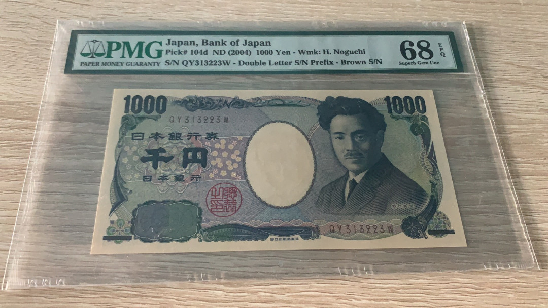 《张总收藏》第六期——人与动物 日本2004年1000千单PMG68E