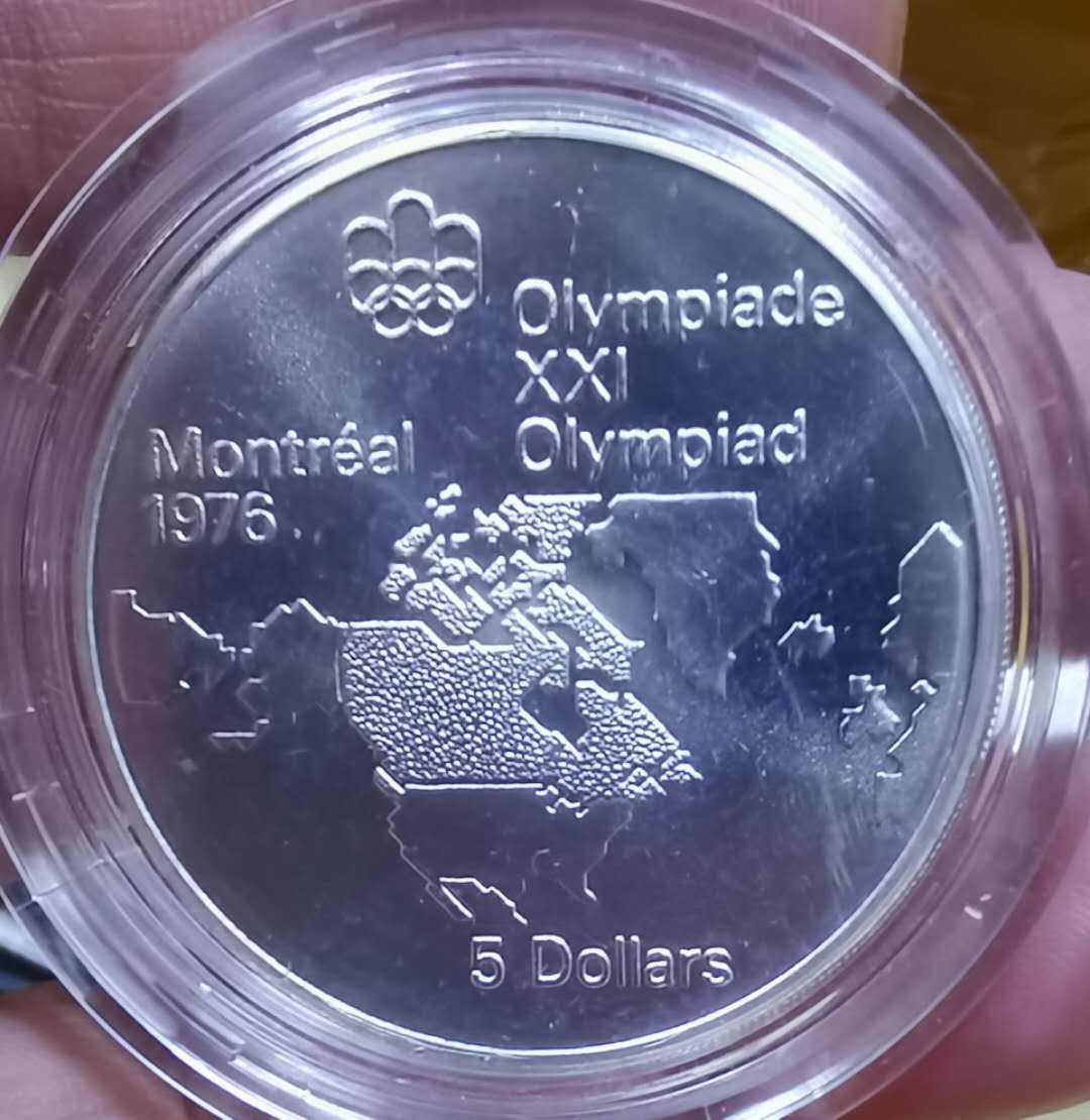 北京马甸外币专卖微拍第三十二期。银币专场，陆续上新，欢迎关注 1976年加拿大蒙特利尔奥运会纪念银币，重24.3克，成色：925，品相如图