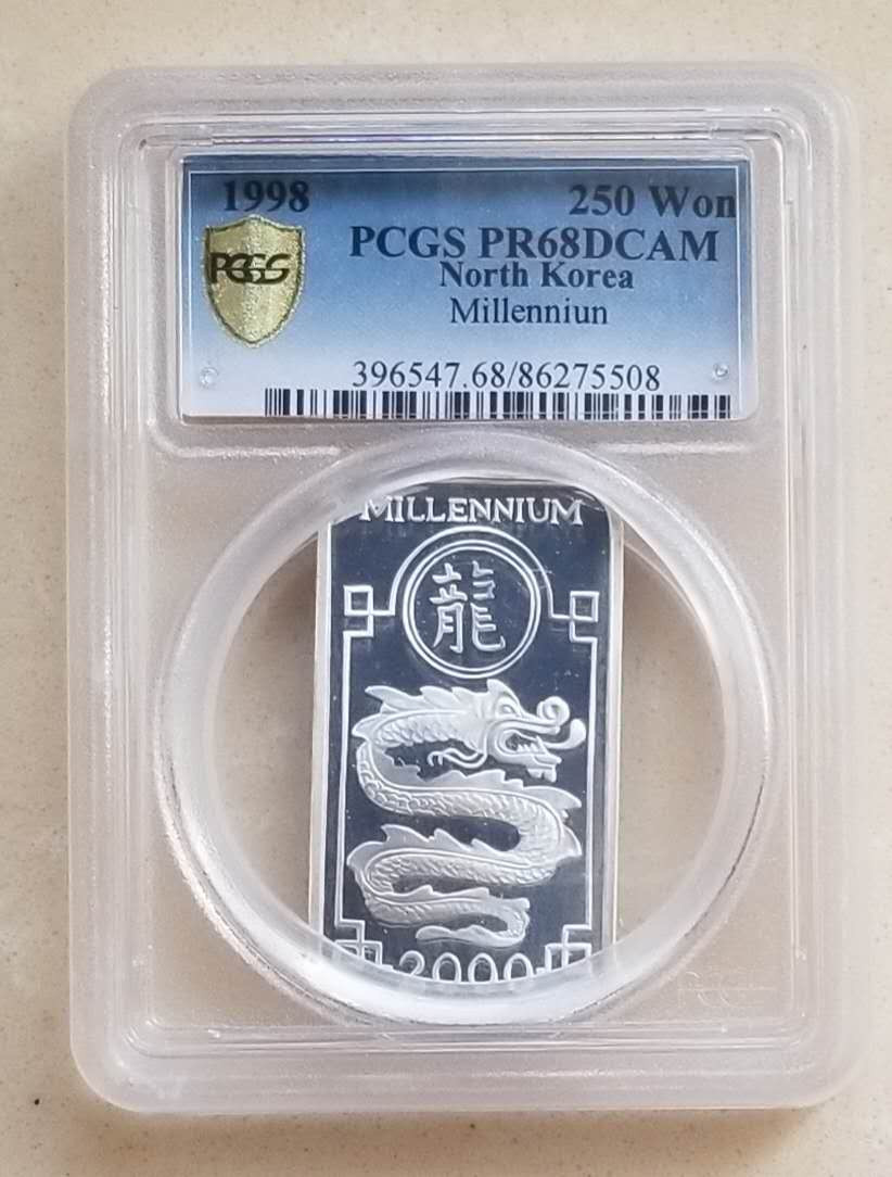 【币观天下】第131期钱币拍卖～ PCGS评级币朝鲜1998年千禧龙年方形纪念银币