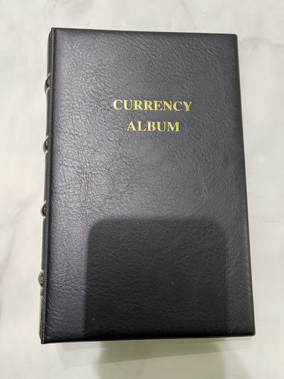 《外钞收藏家》第一百零二期拍卖 - 殷氏裸币便携册 配30张内页 近全新（不包含纸币）