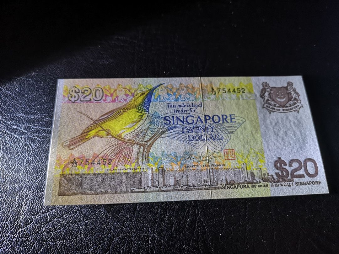 《外钞收藏家》第一百一十期拍卖 新加坡鸟版20元 全新UNC BWC印钞