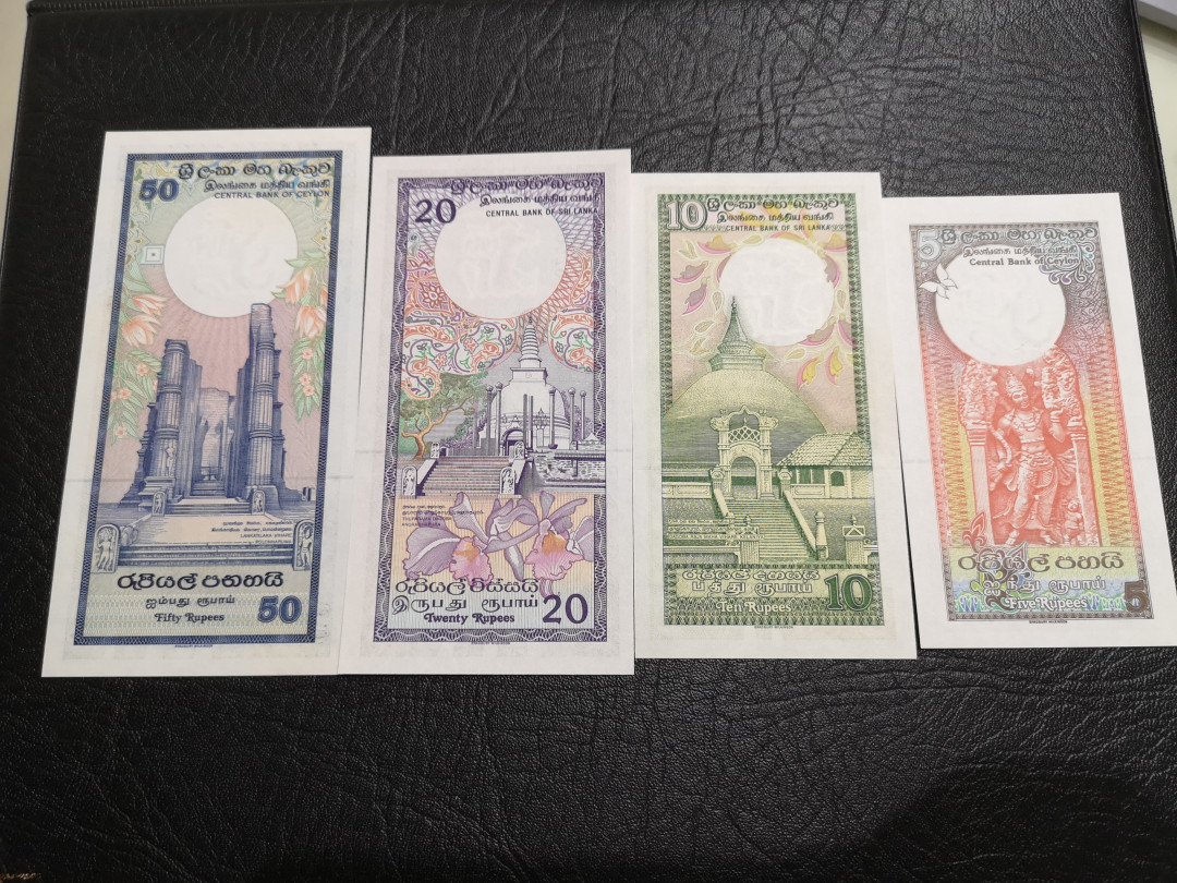 《外钞收藏家》第一百一十期拍卖 锡兰50、20、10、5四张 全新 个别有潮点 BWC印钞