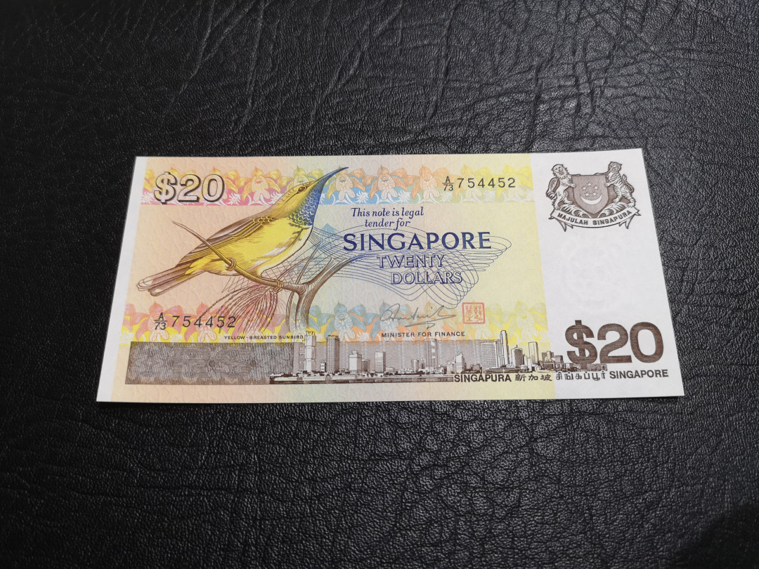 《外钞收藏家》第一百一十期拍卖 新加坡鸟版20元 全新UNC BWC印钞