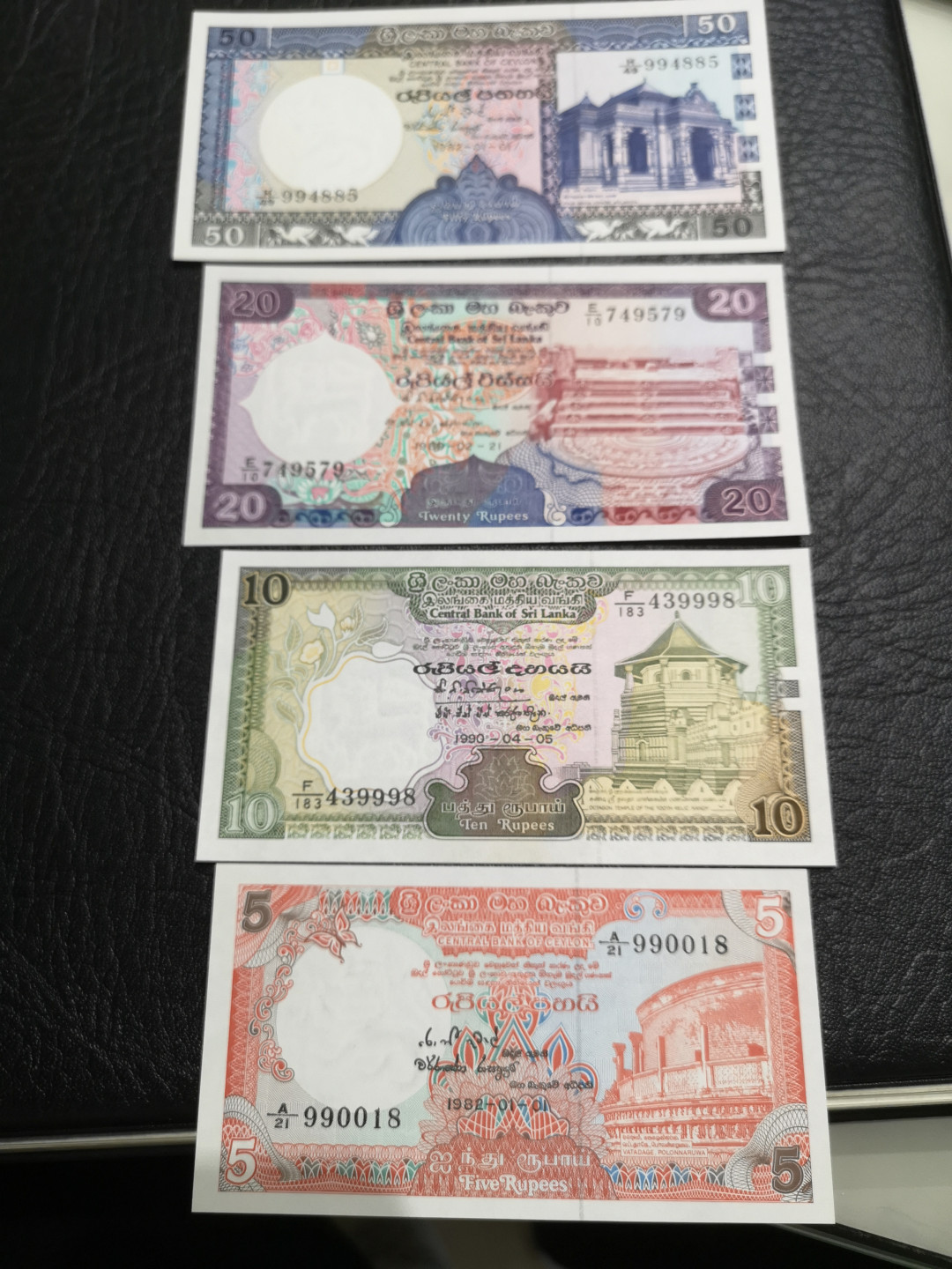 《外钞收藏家》第一百一十期拍卖 锡兰50、20、10、5四张 全新 个别有潮点 BWC印钞