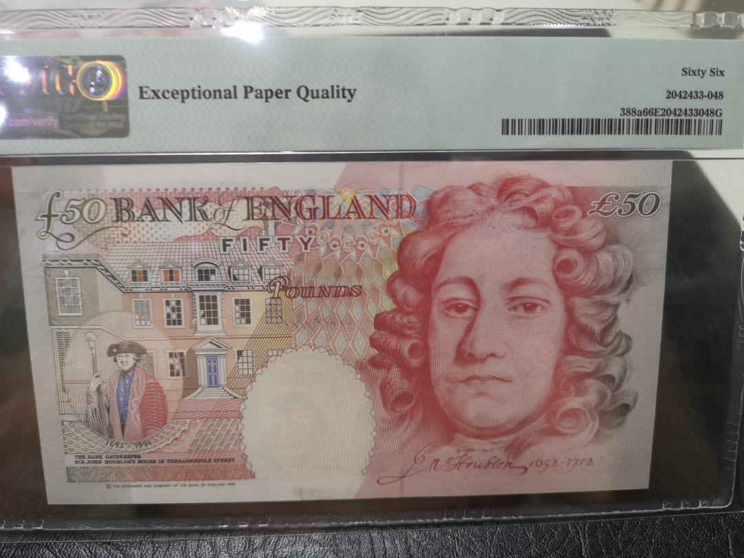 《外钞收藏家》第一百一十五期拍卖 1994年英国E序列20镑 PMG66 A01首发冠