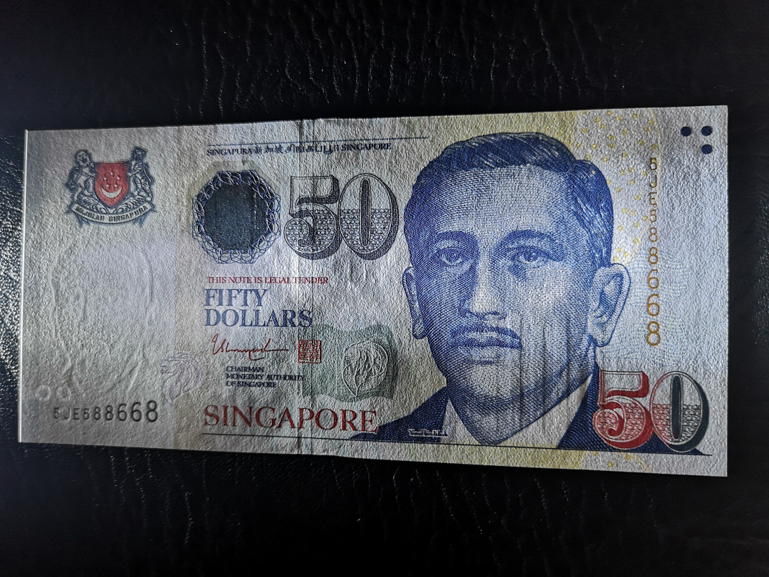 《外钞收藏家》第一百一十七期拍卖 新加坡人像版50  全新UNC 靓号