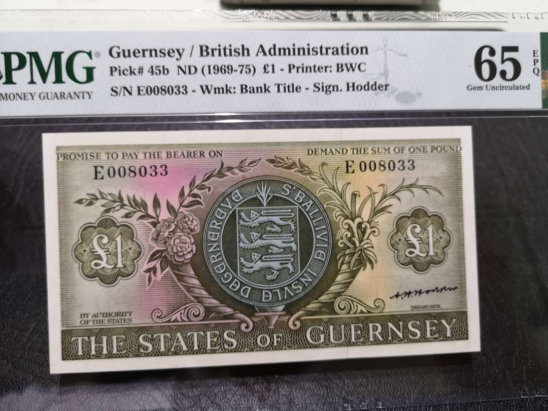 《外钞收藏家》第一百一十八期拍卖 根西 彩背版1镑 BWC作品 PMG65 无47