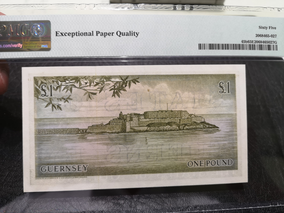《外钞收藏家》第一百一十八期拍卖 根西 彩背版1镑 BWC作品 PMG65 无47