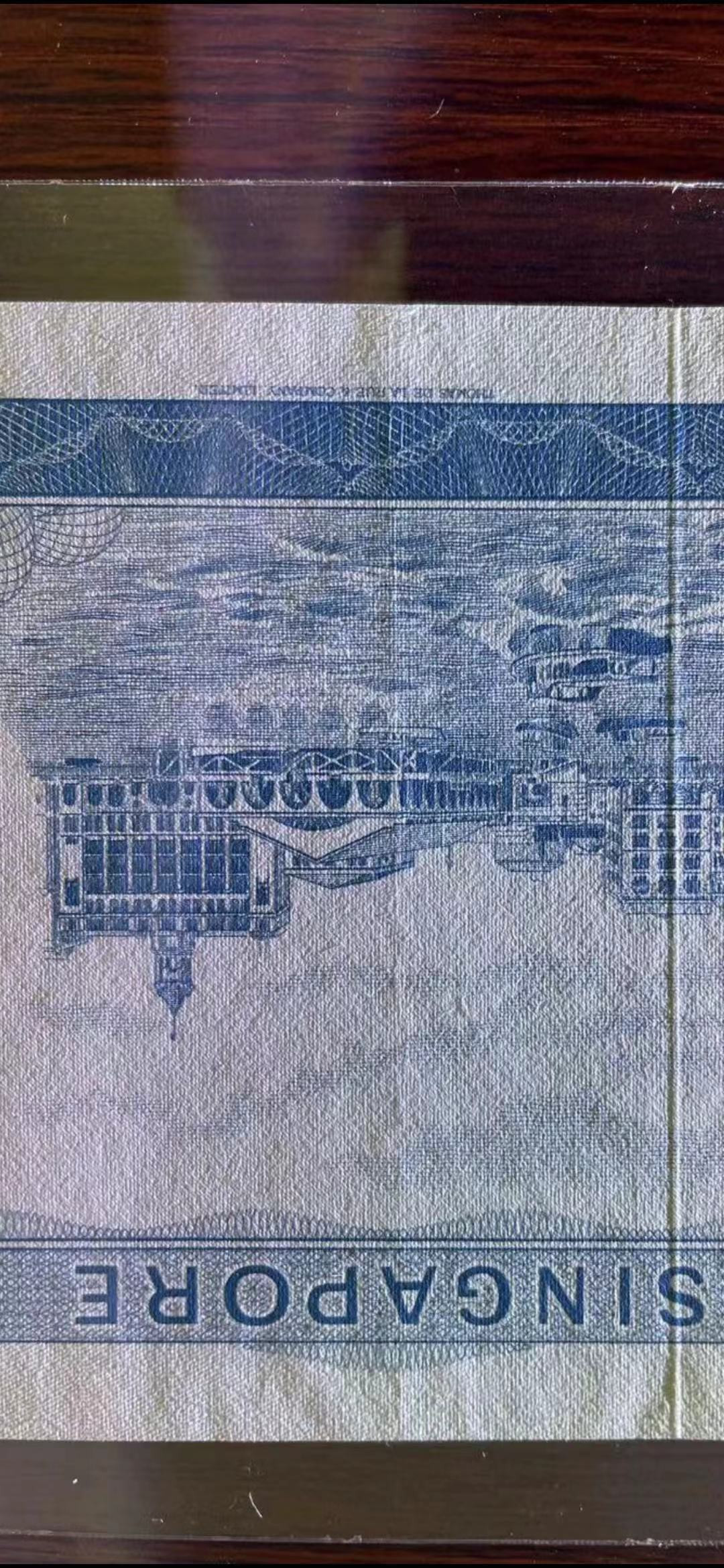 《外钞收藏家》第一百一十八期拍卖 心新加坡花版50 AU品相有暗折