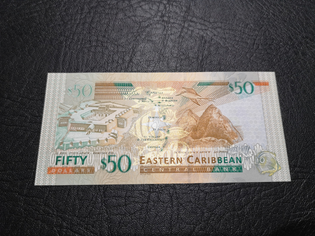 《外钞收藏家》第一百一十九期拍卖（本期106件拍品） 2010年东加勒比50 全新UNC