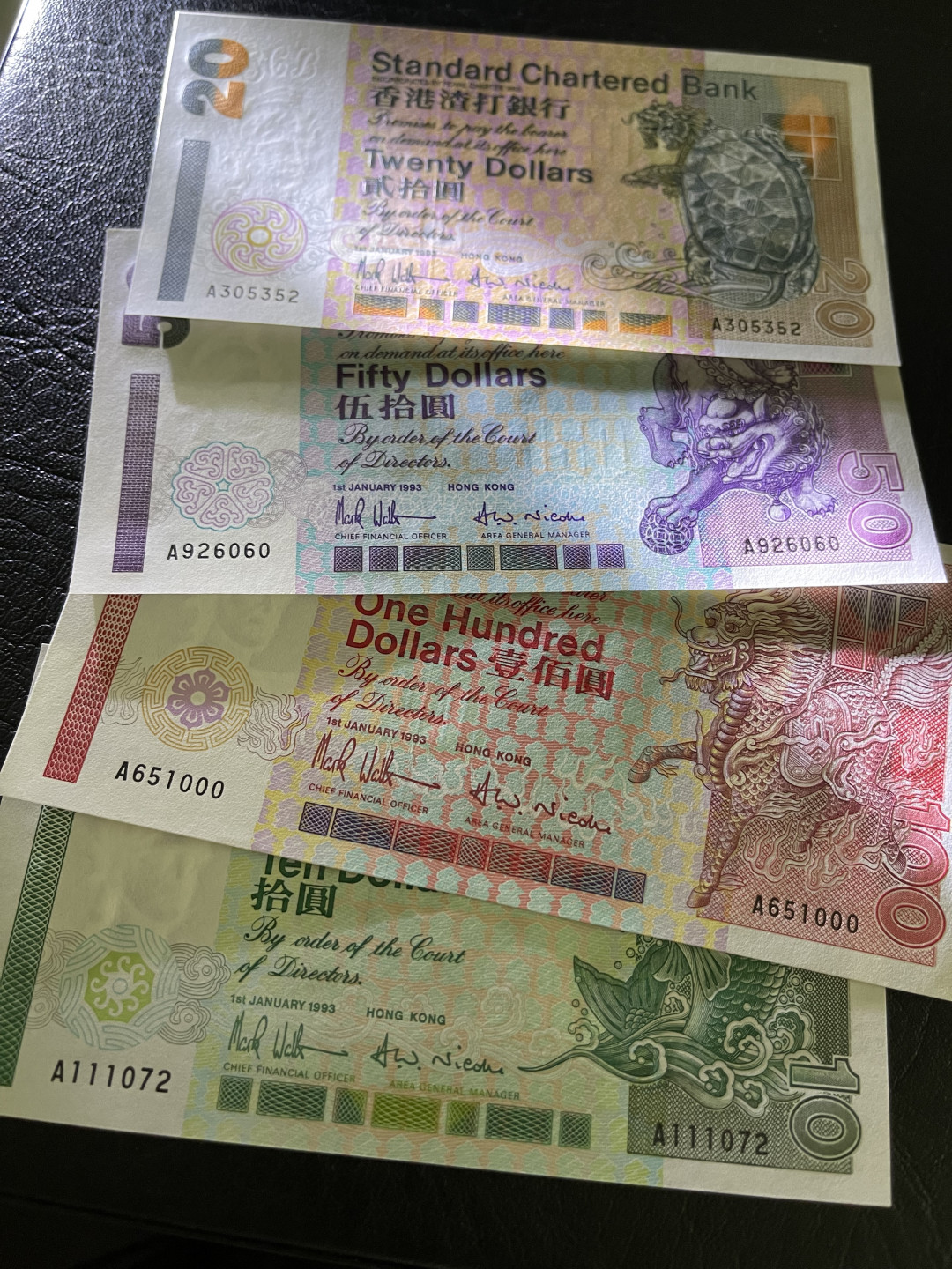 《外钞收藏家》第一百一十九期拍卖（本期106件拍品） 1993年香港渣打银行四张小套 50有少许潮癍 其他全新UNC