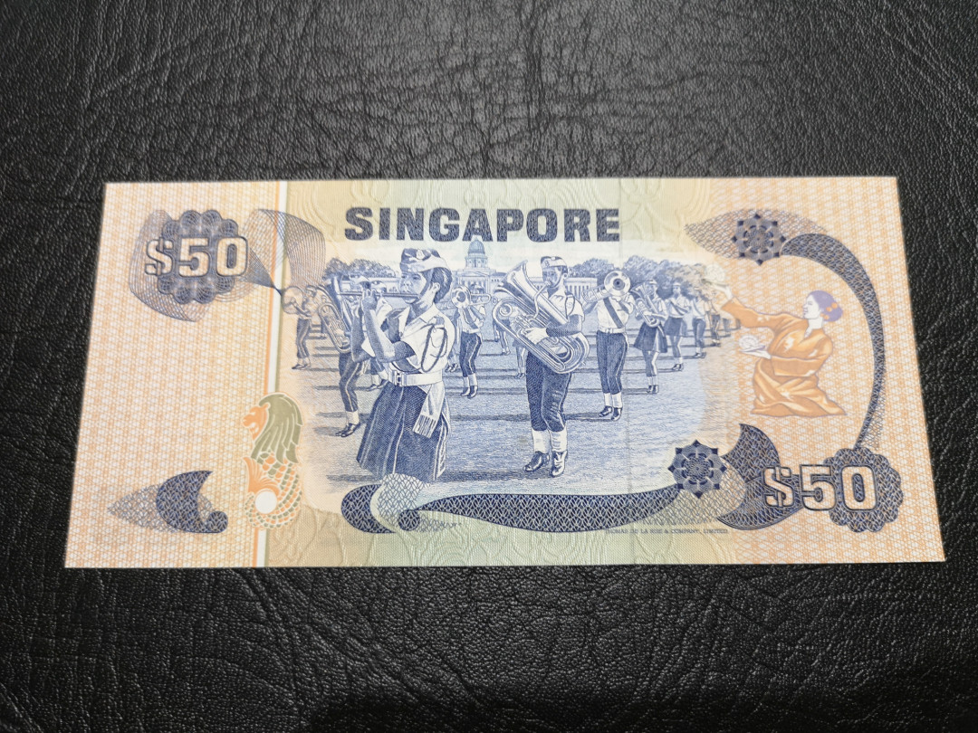 《外钞收藏家》第一百一十九期拍卖（本期106件拍品） 新加坡鸟版50元 近全新 边上有点潮癍