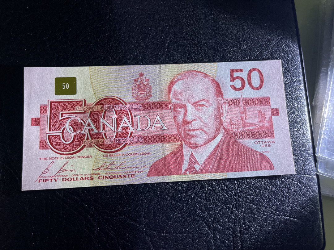 《外钞收藏家》第一百一十九期拍卖（本期106件拍品） 加拿大鸟版50加元 有疑似软折 鉴定AU