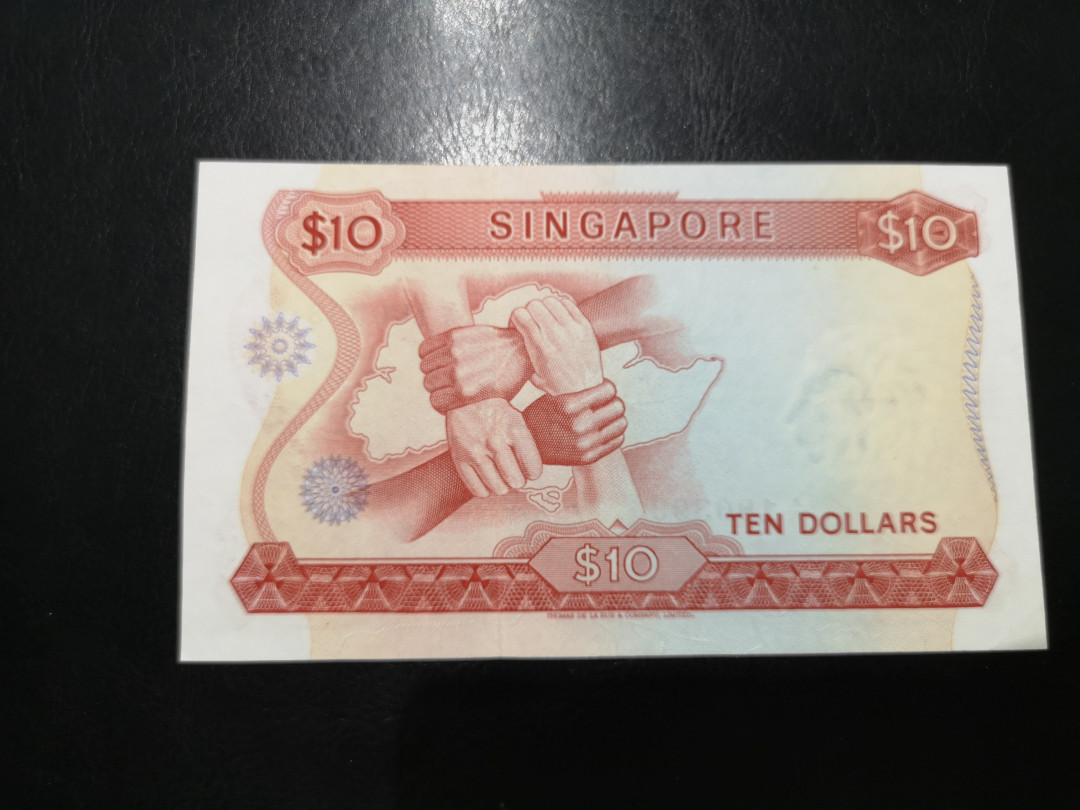 《外钞收藏家》第一百二十四期拍卖 新加坡花版10元 近全新 轻微受潮