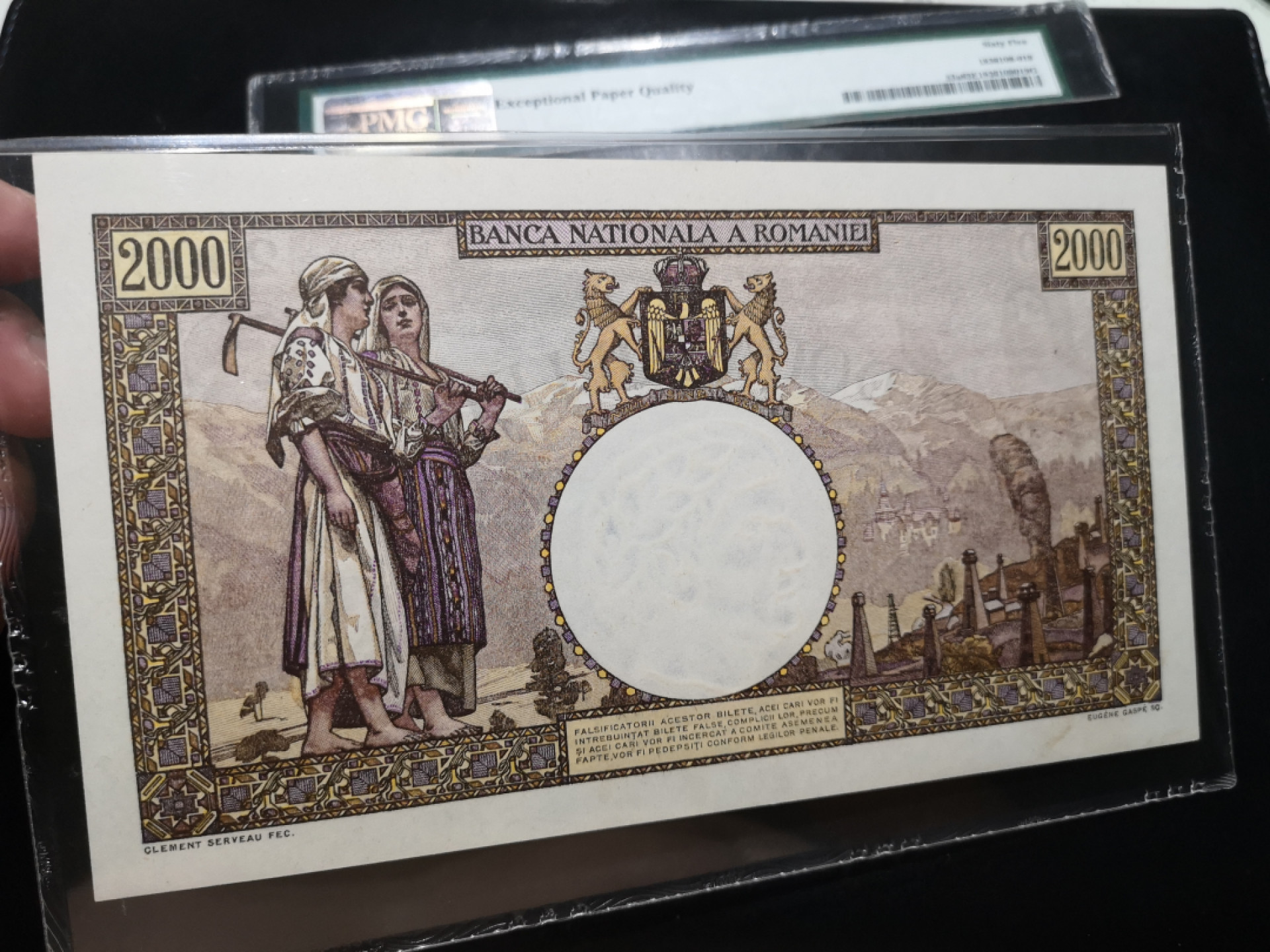 《外钞收藏家》第一百二十五期拍卖 1941年罗马尼亚2000 PMG65 但是但是但是......分数部分壳子被剪了 纸币部分封装完好