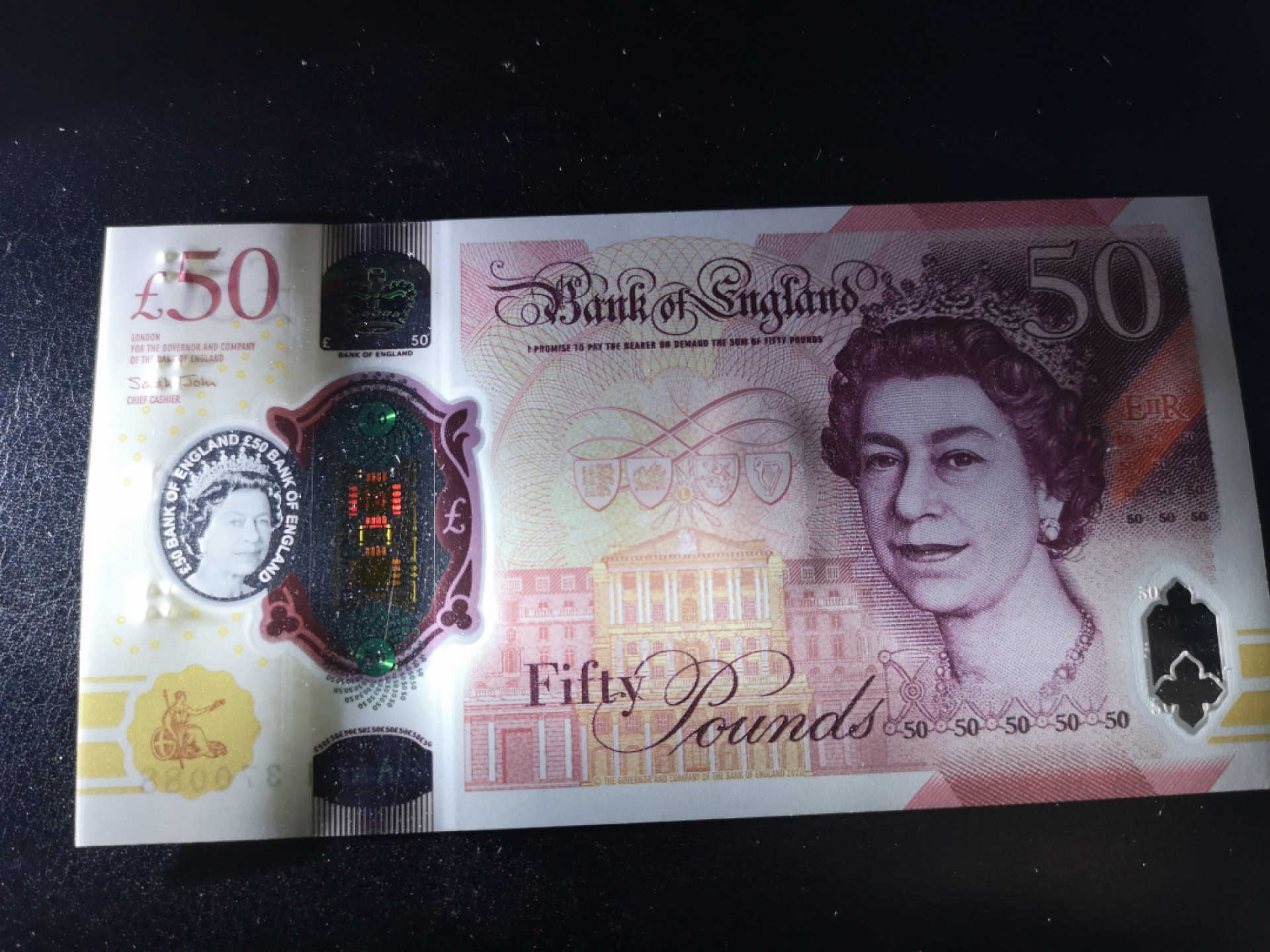 《外钞收藏家》第一百二十五期拍卖 英国最新版50镑 AA01冠 尾88 全新绝品