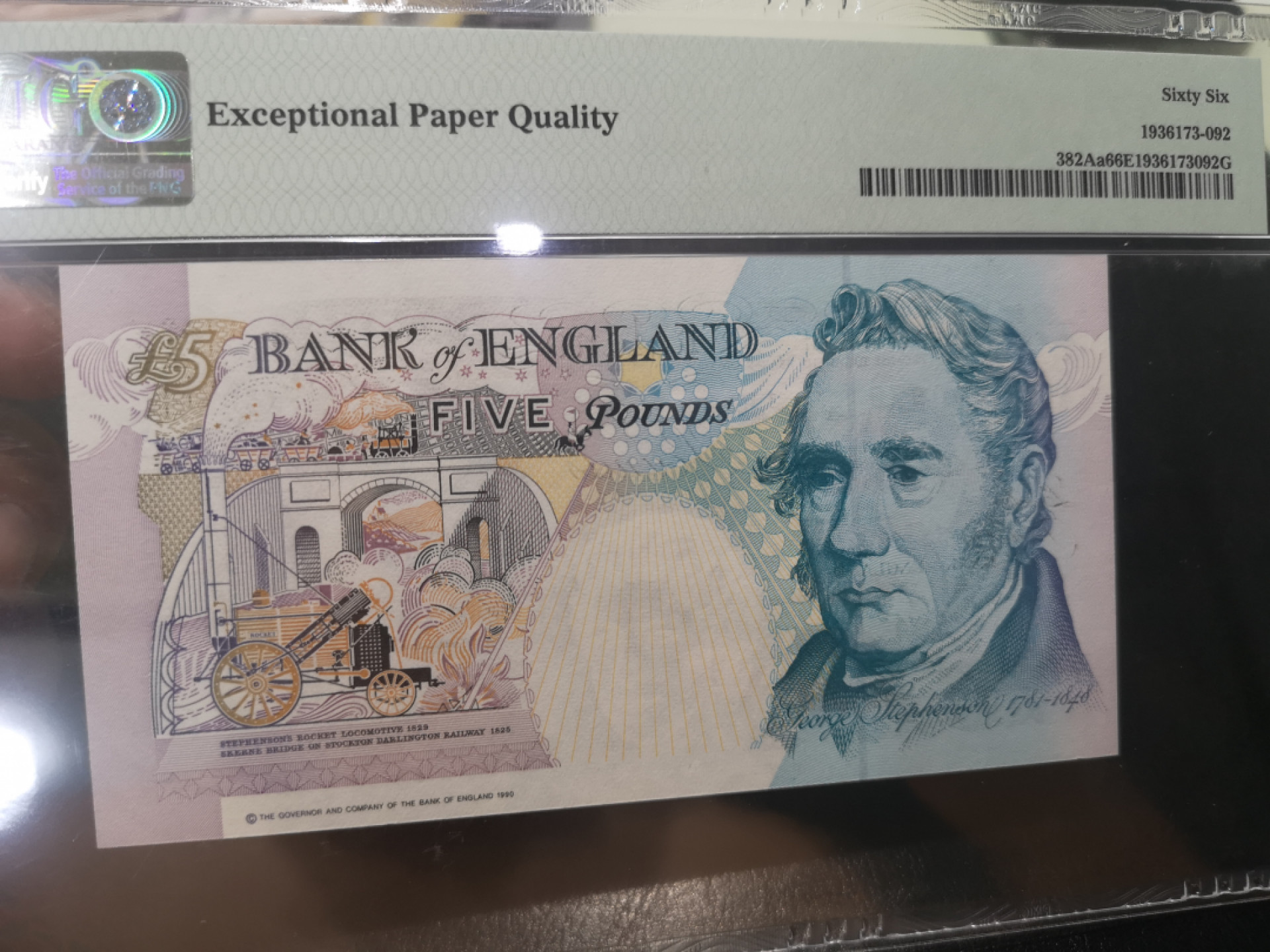 《外钞收藏家》第一百二十八期拍卖 1990英国 E序列 5镑  PMG66 979百位号