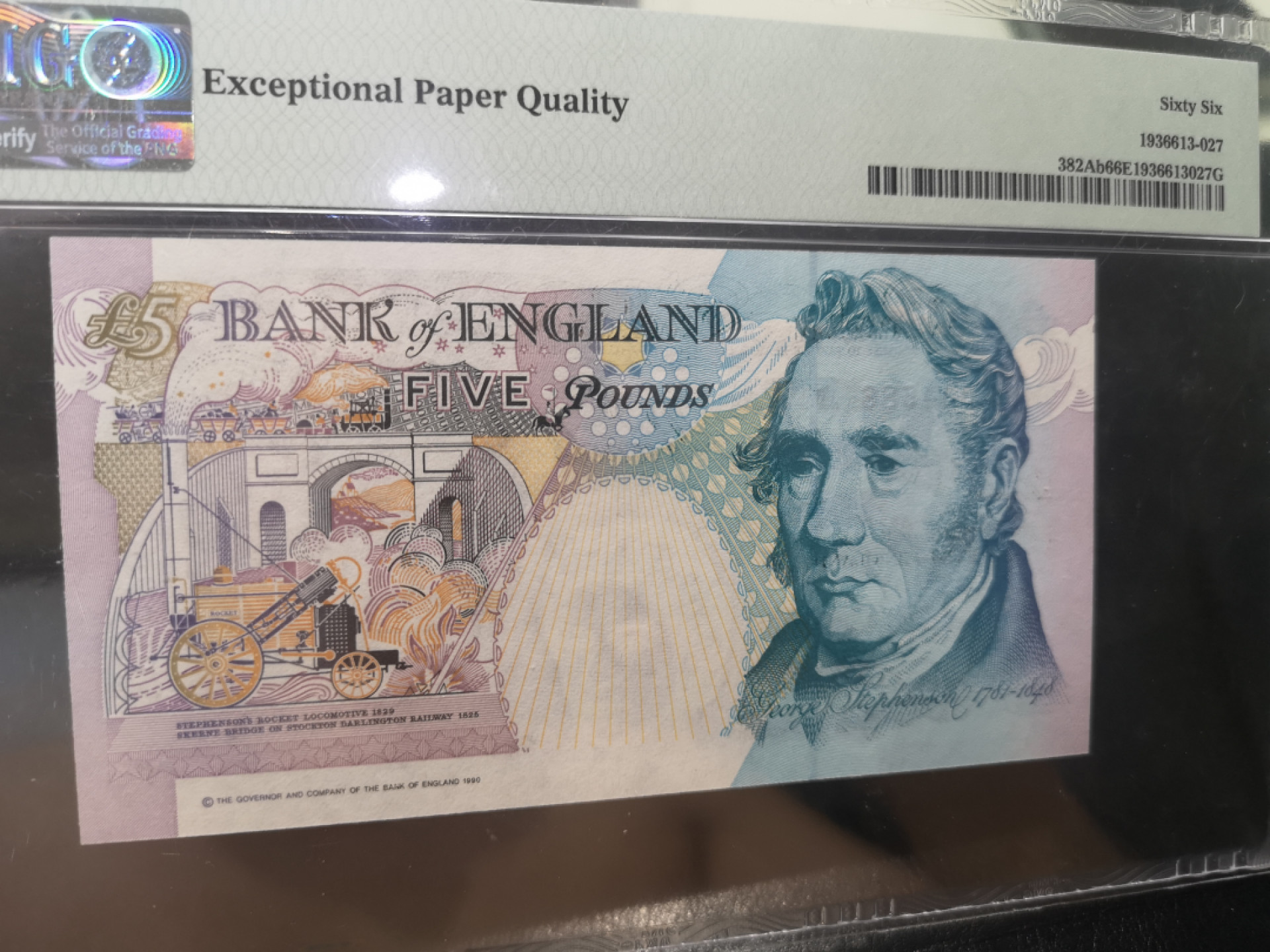 《外钞收藏家》第一百二十八期拍卖 1990英国 E序列 5镑  PMG66 千位号