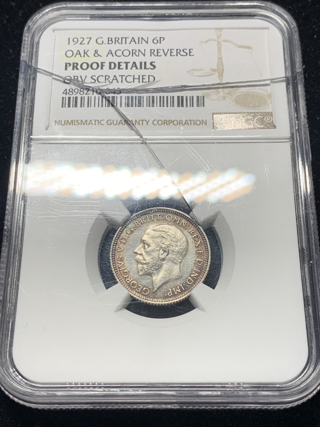 《竞宝斋》钱币微拍-第8场（不限金额顺丰包邮） NGC Proof Details OBV Scratched 英国1927年乔治五世精制6便士 NGC编号：4898210-043 盒子有裂