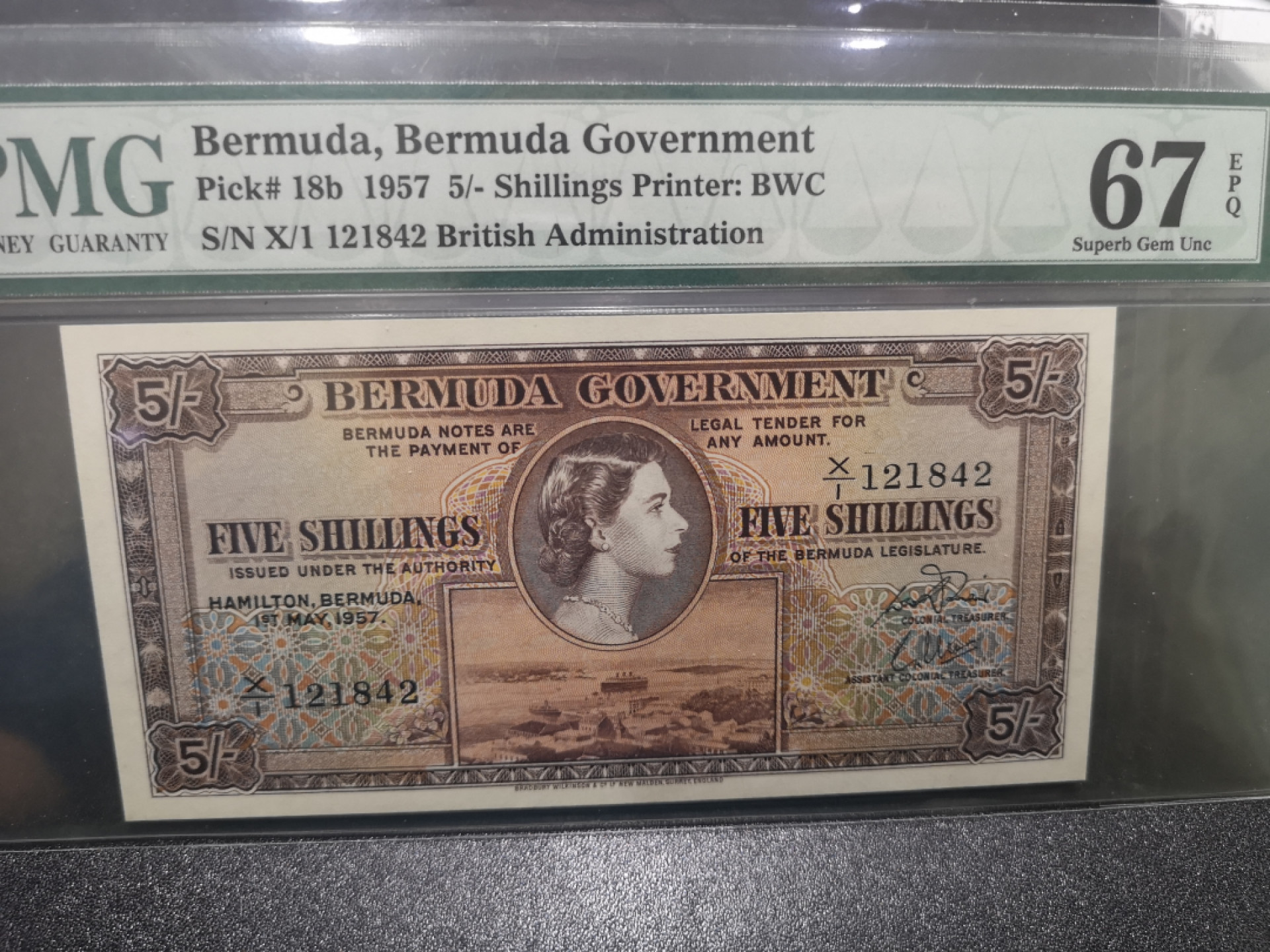 《外钞收藏家》第一百三十六期（本期100件） 1957百慕大女王5先令 PMG67 BWC作品
