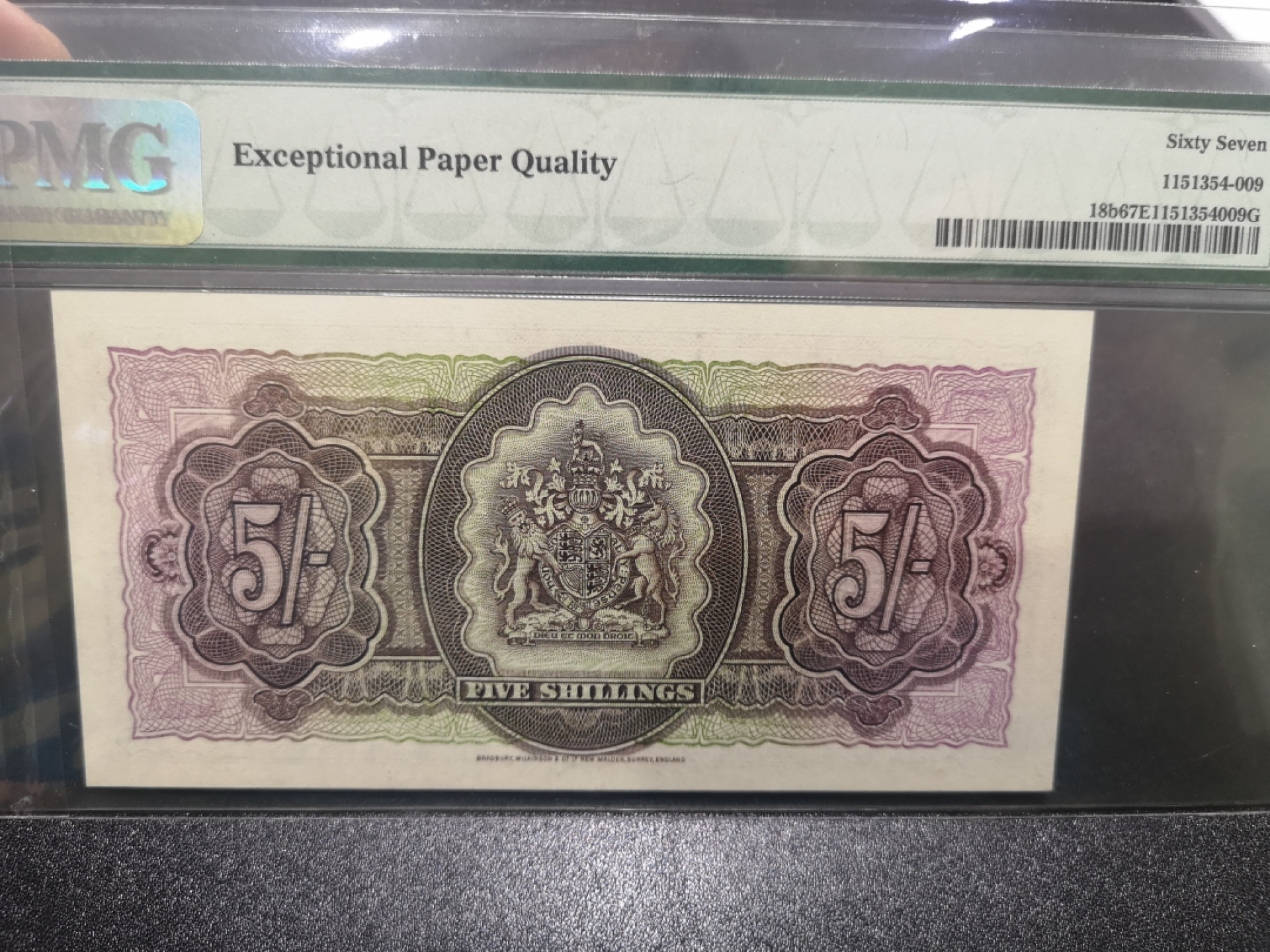 《外钞收藏家》第一百三十六期（本期100件） 1957百慕大女王5先令 PMG67 BWC作品