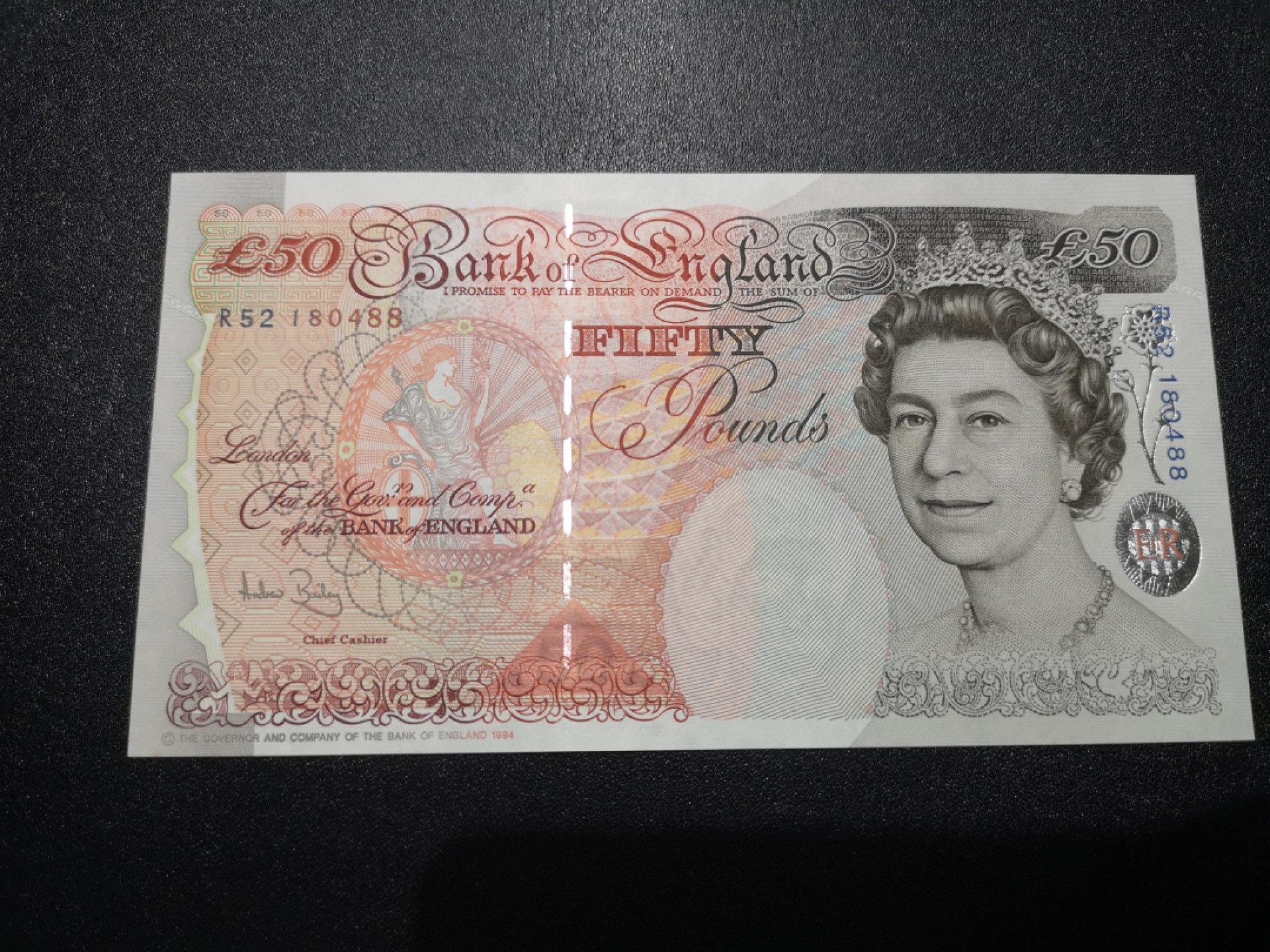 《外钞收藏家》第一百三十八期拍卖（本期91件） 1994年英国E序列50镑 全新 凹凸很强 可惜有星星点点潮癍
