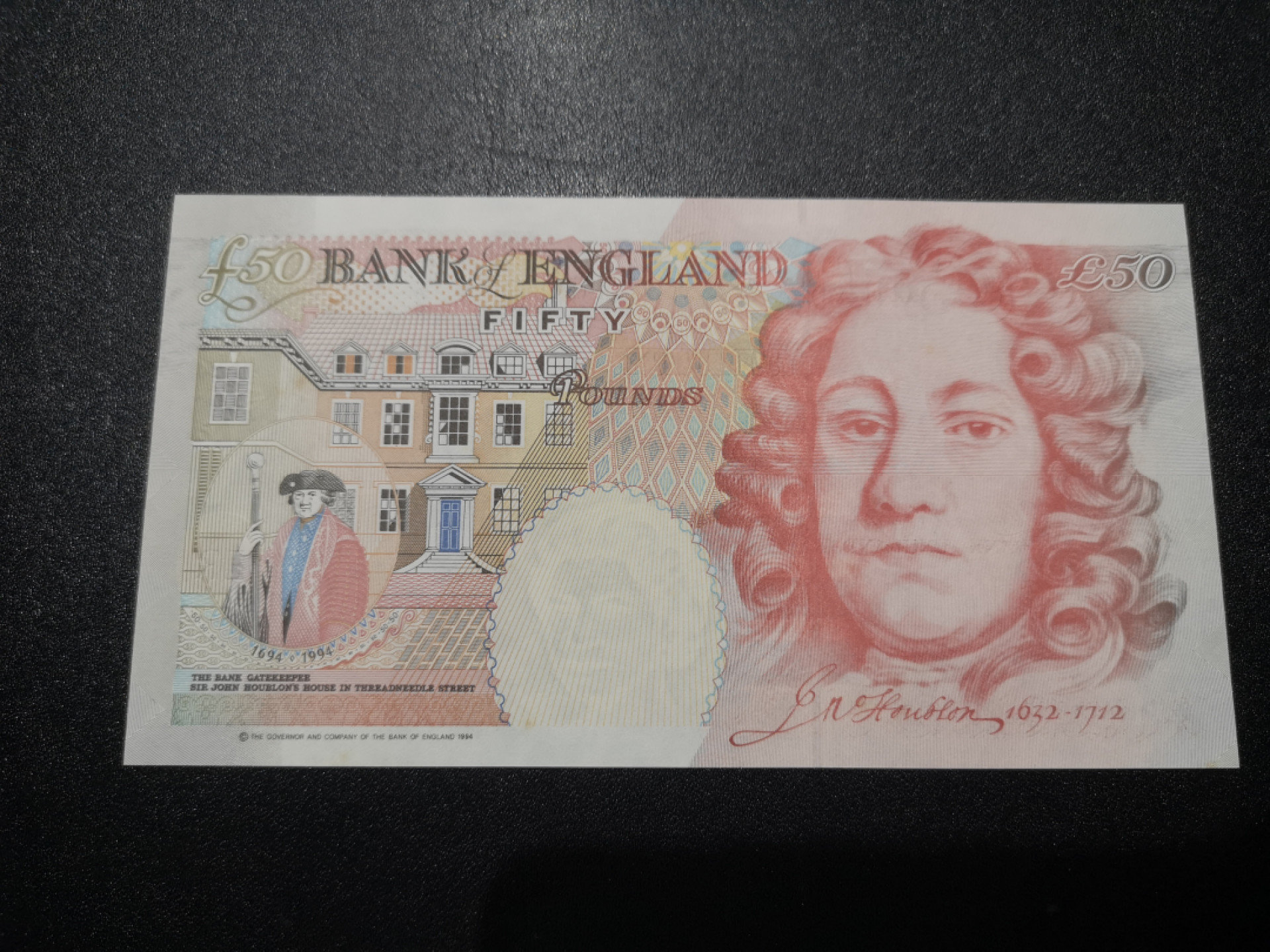 《外钞收藏家》第一百三十八期拍卖（本期91件） 1994年英国E序列50镑 全新 凹凸很强 可惜有星星点点潮癍