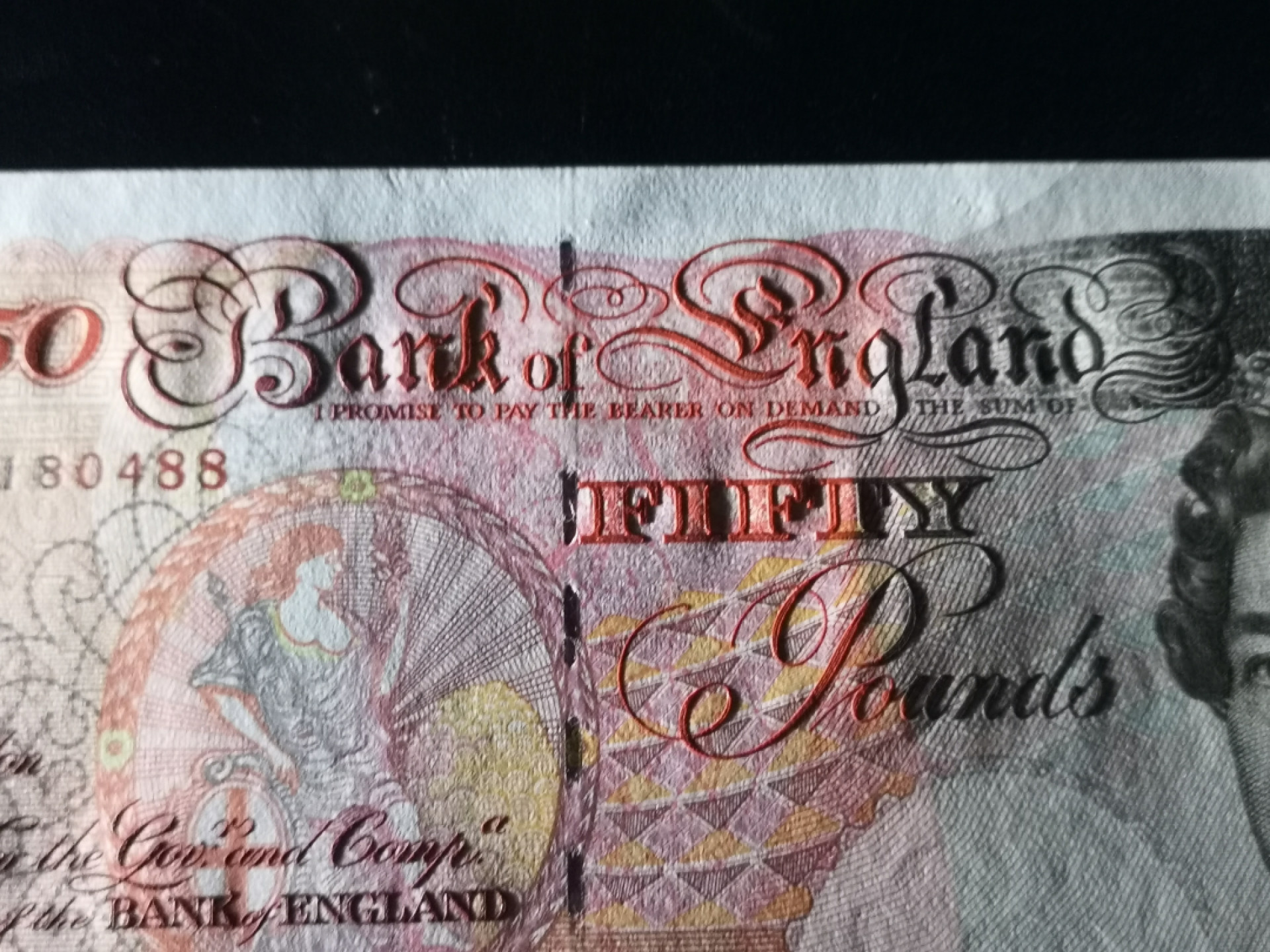 《外钞收藏家》第一百三十八期拍卖（本期91件） 1994年英国E序列50镑 全新 凹凸很强 可惜有星星点点潮癍