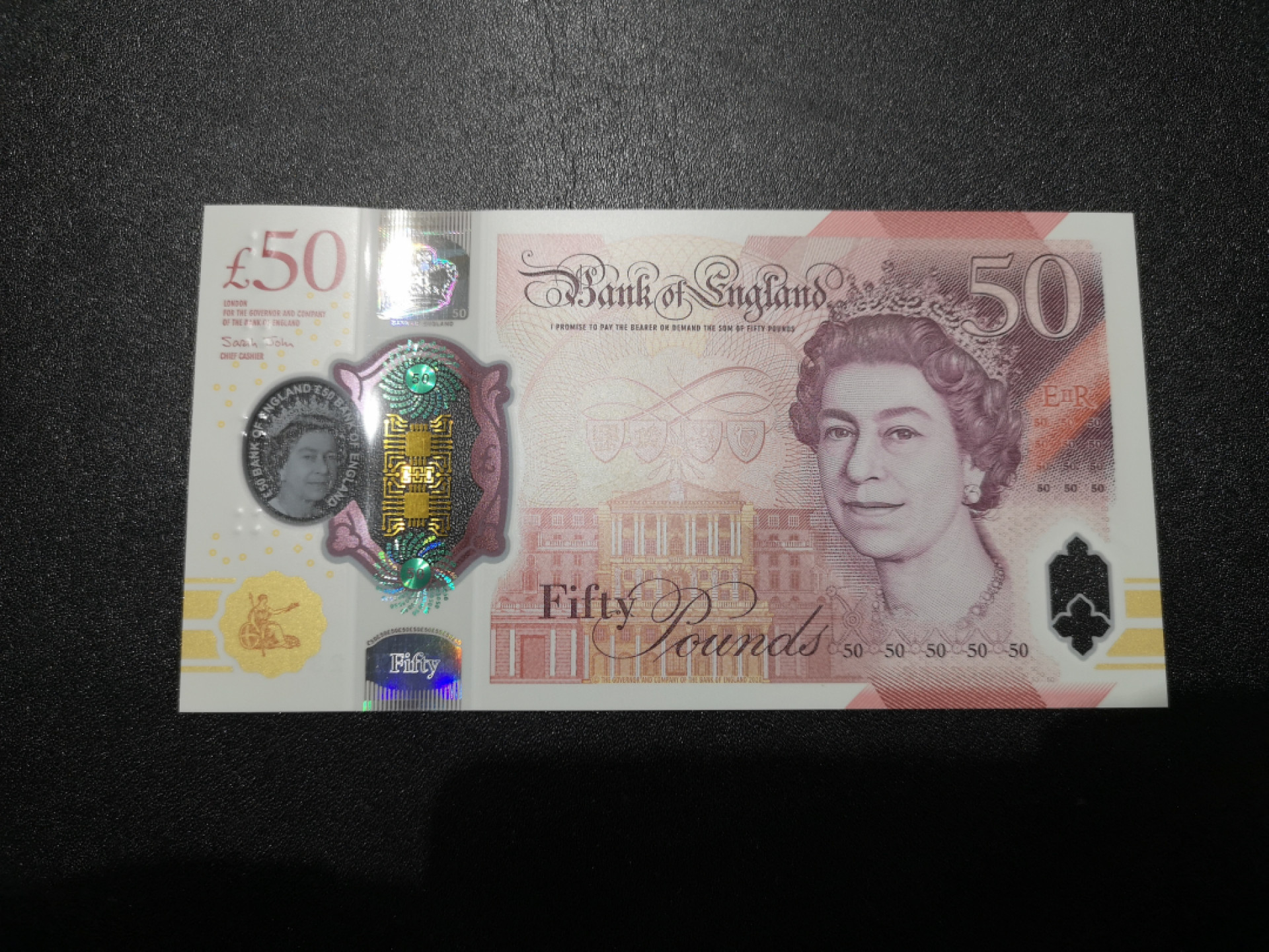 《外钞收藏家》第一百四十四期拍卖（本期85件） 英国最新版塑料钞50镑 AA01首发冠 全新UNC 跟上张连号