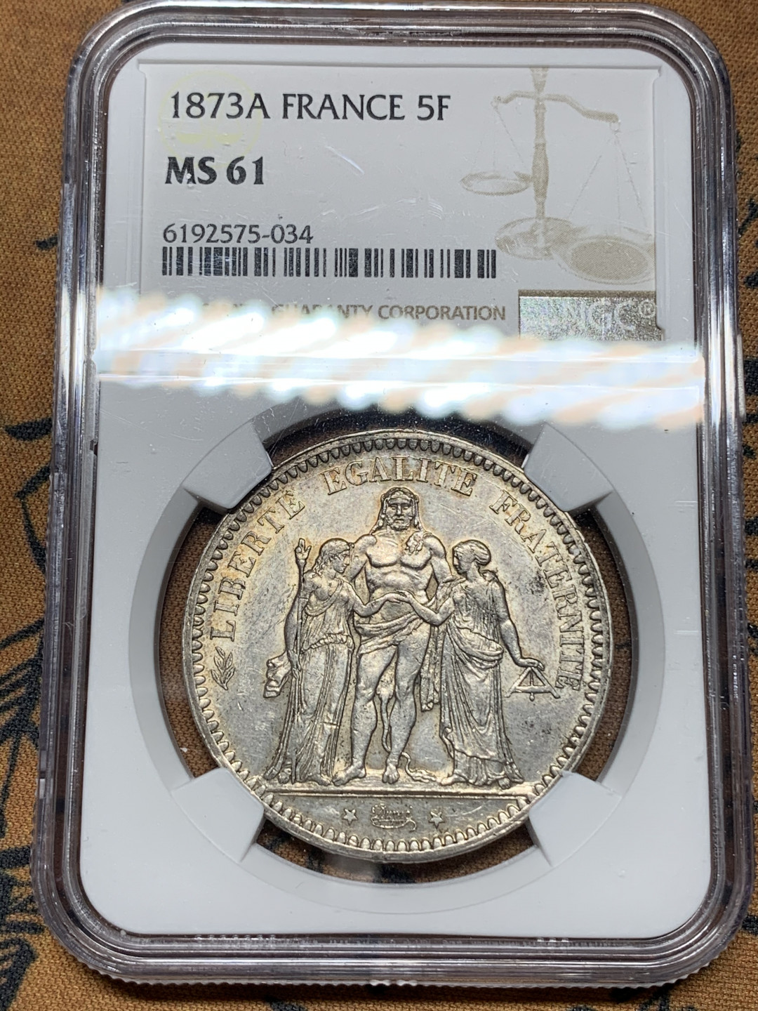 《竞宝斋》钱币微拍-第13场-本周日，周一2场连拍（全场顺丰包邮） NGC-MS61 法国 1873-A年 大力神 5法郎 银币 淡彩包浆 很漂亮