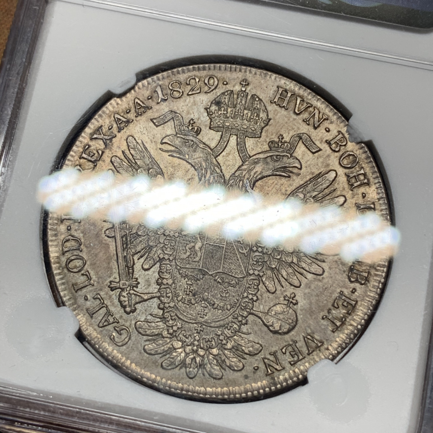 《竞宝斋》钱币微拍-第13场-本周日，周一2场连拍（全场顺丰包邮） 第三名 NGC-AU55 奥地利 1829年 佛朗茨一世 1泰勒 银币 漂亮的欧洲包浆