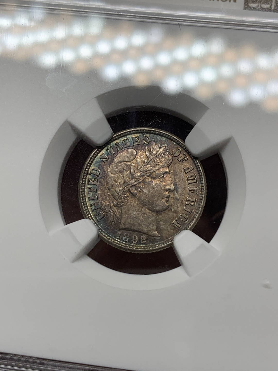 《竞宝斋》钱币微拍-第13场-本周日，周一2场连拍（全场顺丰包邮） NGC-AU58 美国 1892年 巴伯 10cents(Dime) 首年 少见透打，五彩包浆 出分不易