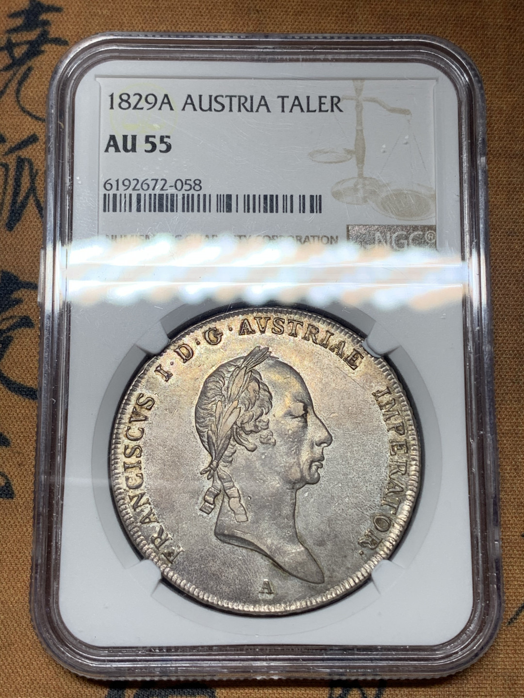 《竞宝斋》钱币微拍-第13场-本周日，周一2场连拍（全场顺丰包邮） 第三名 NGC-AU55 奥地利 1829年 佛朗茨一世 1泰勒 银币 漂亮的欧洲包浆