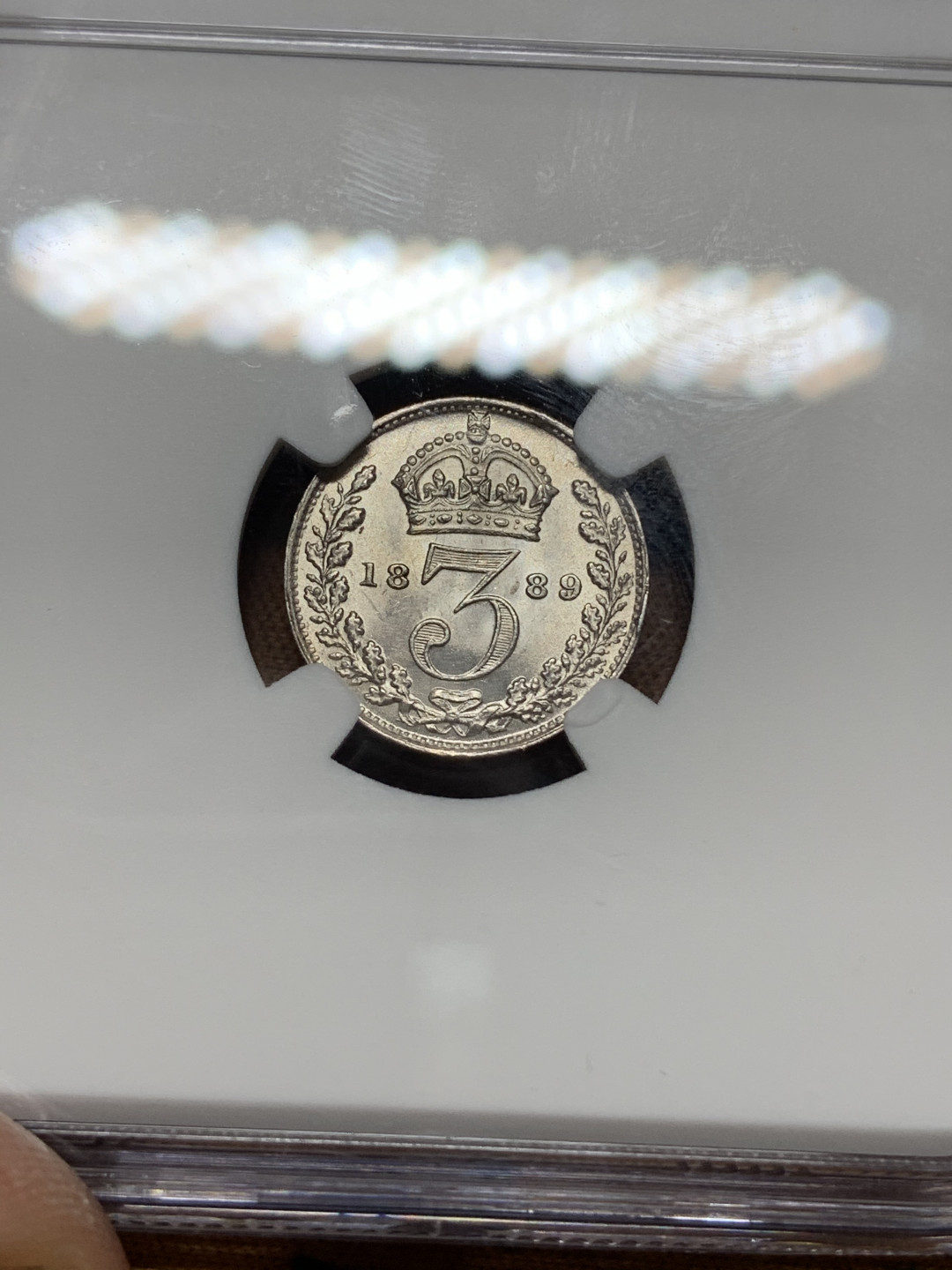 《竞宝斋》钱币微拍-第13场-本周日，周一2场连拍（全场顺丰包邮） NGC MS62 英国1889年3便士 NGC编号：4417938-008 车轮光