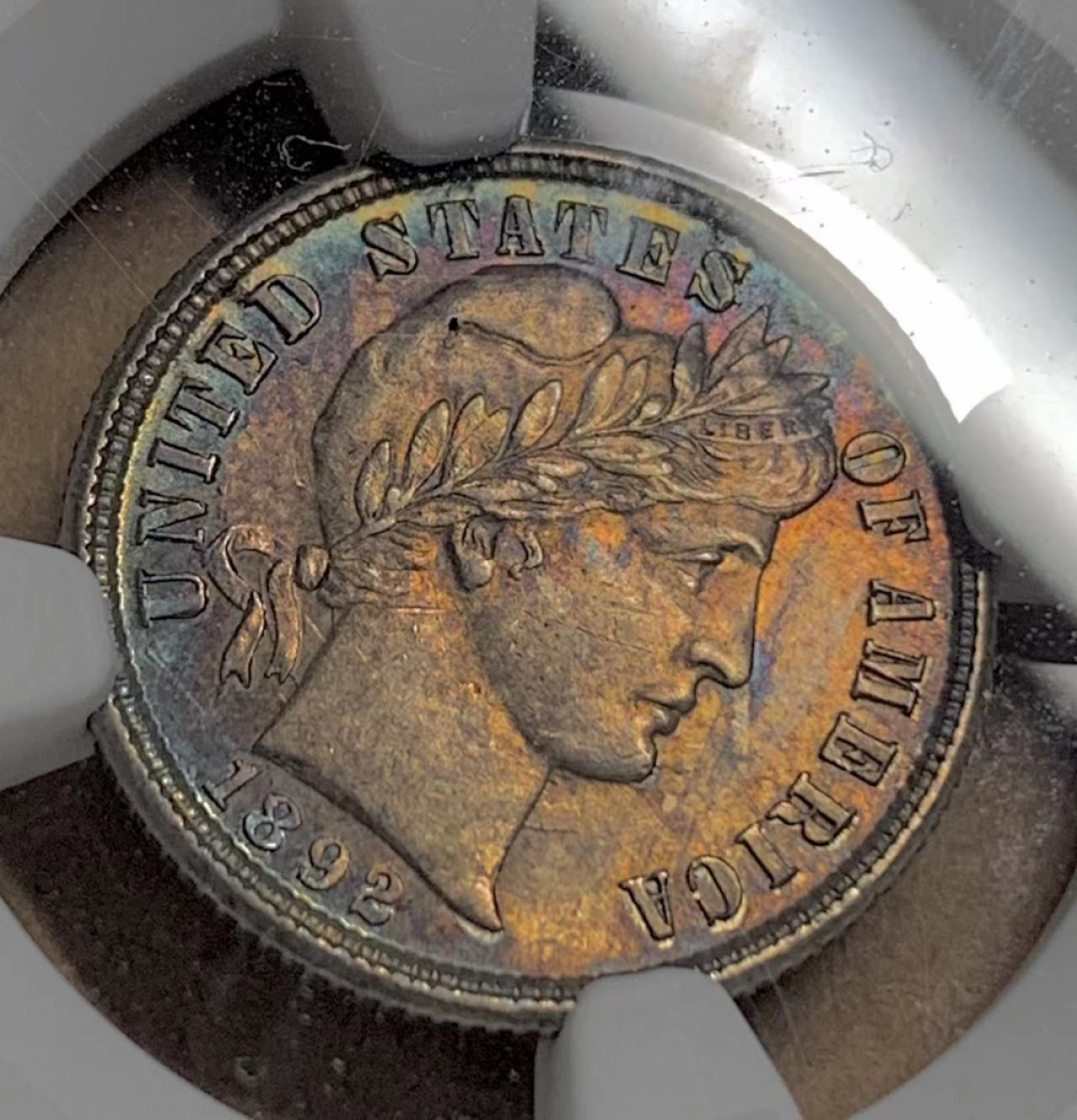 《竞宝斋》钱币微拍-第13场-本周日，周一2场连拍（全场顺丰包邮） NGC-AU58 美国 1892年 巴伯 10cents(Dime) 首年 少见透打，五彩包浆 出分不易