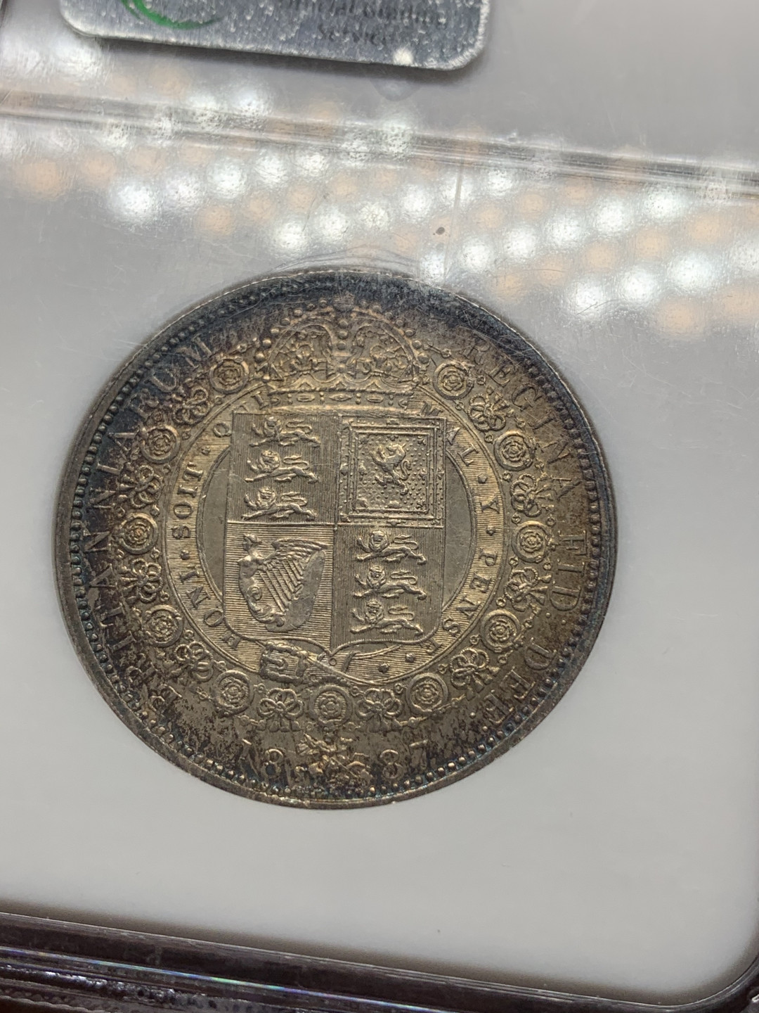 《竞宝斋》钱币微拍-第14场-本周日，周一2场连拍（全场顺丰包邮） NGC-MS62 英国 1887年 半克朗 重彩，对光正面淡金色背面五彩