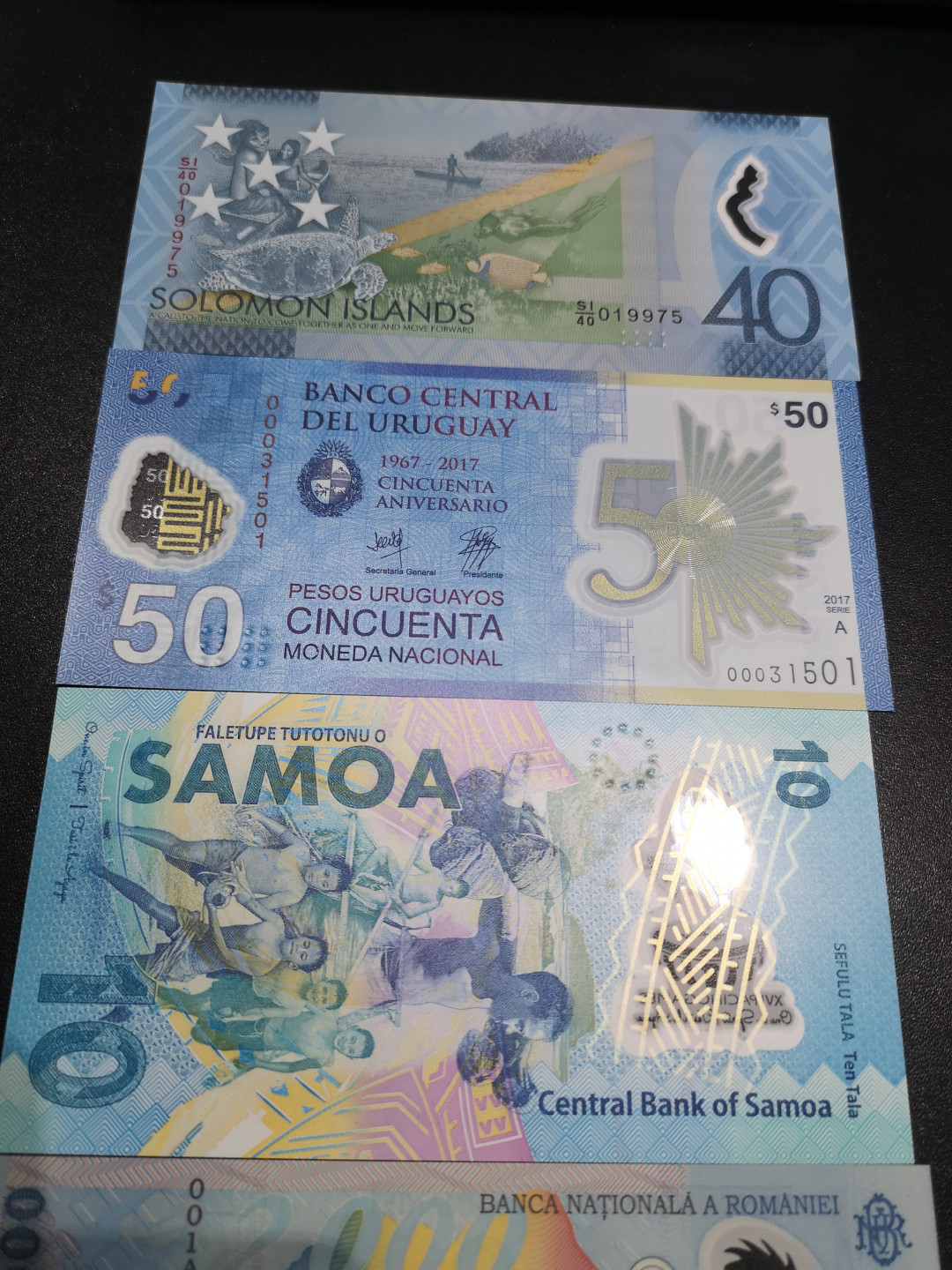 《外钞收藏家》第一百四十六期拍卖-超百件大拍场（本期106件） 所罗门、乌拉圭、萨摩亚、罗马尼亚、冈比亚 纪念钞5张 全新UNC