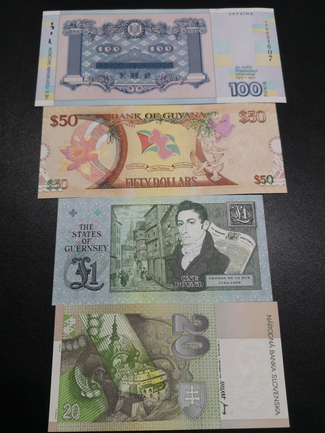 《外钞收藏家》第一百四十六期拍卖-超百件大拍场（本期106件） 乌克兰、圭亚那、格恩西、斯洛伐克 纪念钞4张 全新UNC