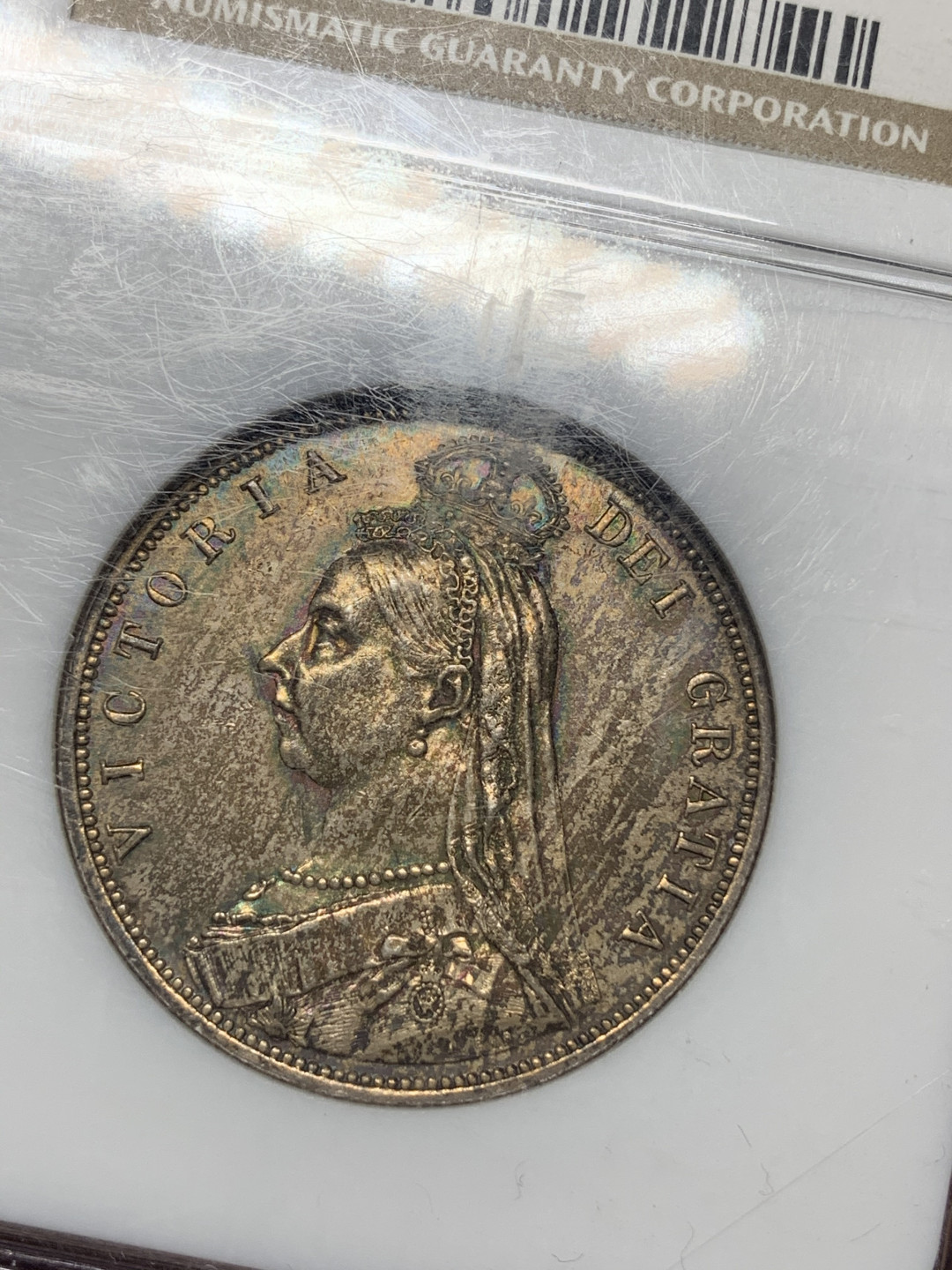 《竞宝斋》钱币微拍-第14场-本周日，周一2场连拍（全场顺丰包邮） NGC-MS62 英国 1887年 半克朗 重彩，对光正面淡金色背面五彩