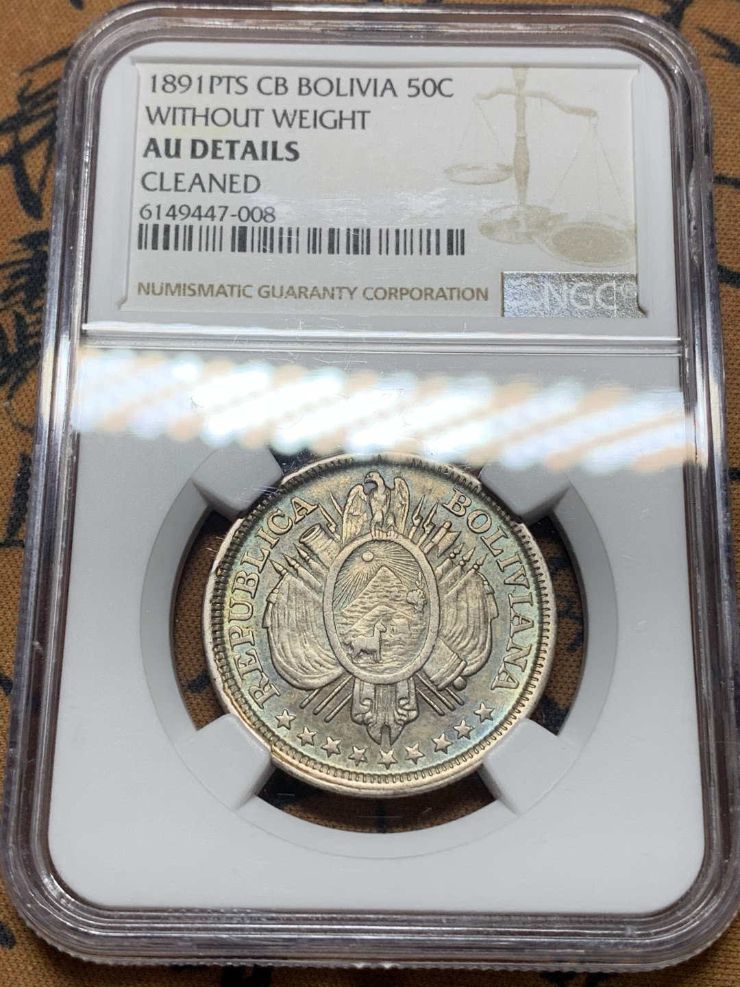 《竞宝斋》钱币微拍-第14场-本周日，周一2场连拍（全场顺丰包邮） NGC-AU 玻利维亚 1891年 无重版 50分 银币 带点蓝彩 很漂亮