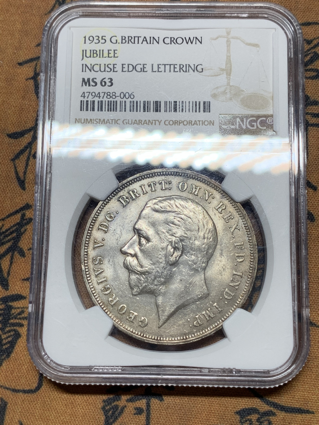 《竞宝斋》钱币微拍-第14场-本周日，周一2场连拍（全场顺丰包邮） NGC-MS63 英国 1935年木马剑一克朗 银币