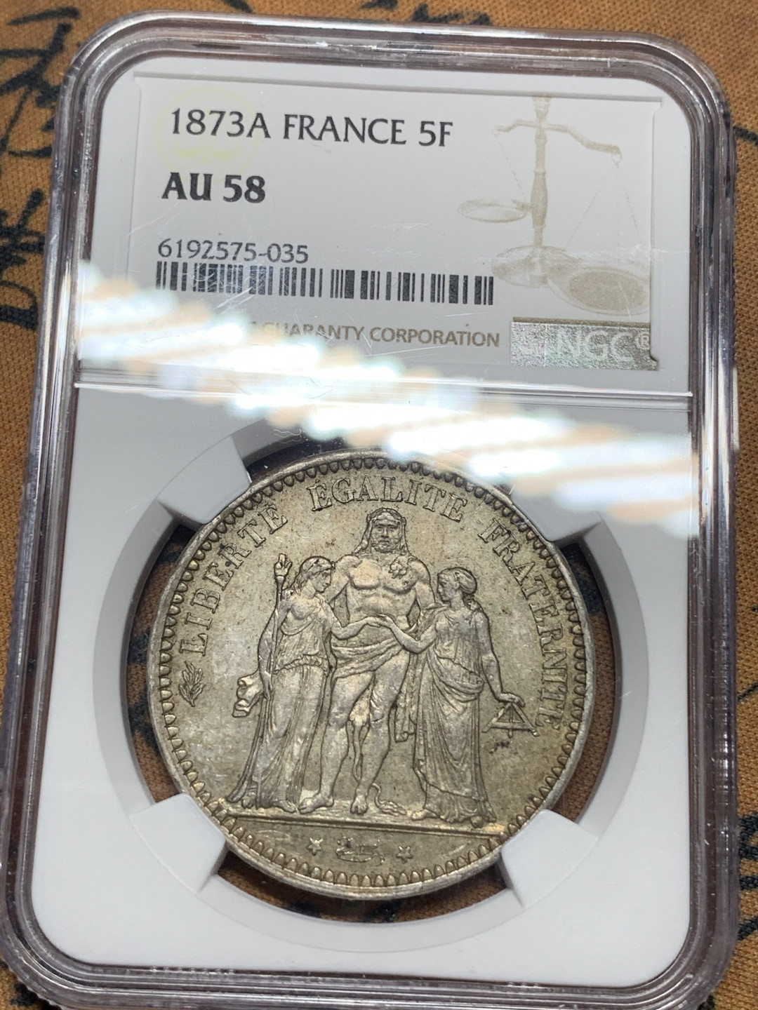 《竞宝斋》钱币微拍-第14场-本周日，周一2场连拍（全场顺丰包邮） NGC-AU58 法国 1873年 大力神 5法郎 银币 原味带彩好品