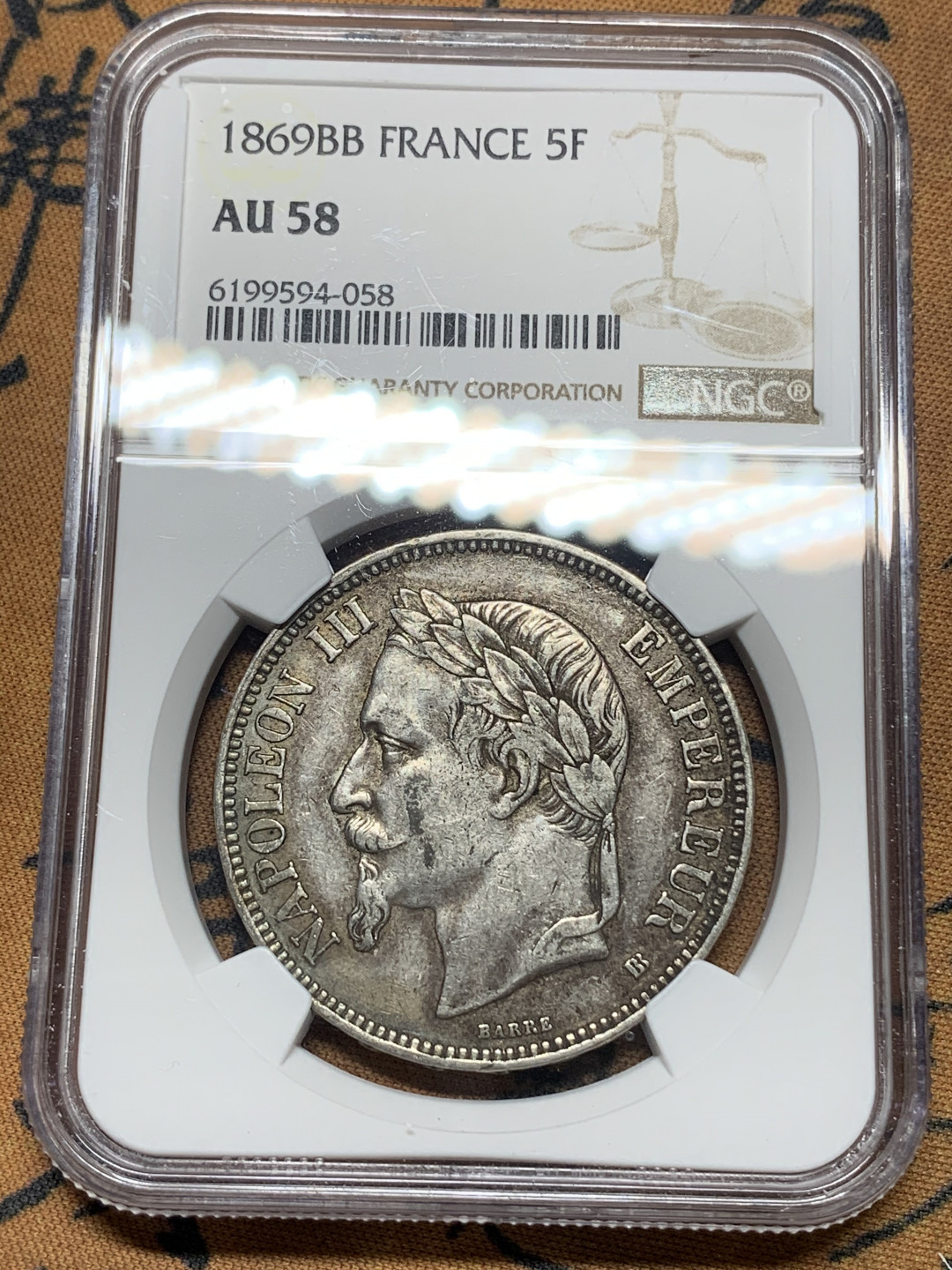 《竞宝斋》钱币微拍-第14场-本周日，周一2场连拍（全场顺丰包邮） NGC-AU58 法国 1869-BB年 拿破仑三世 5法郎 银币 原味酱彩