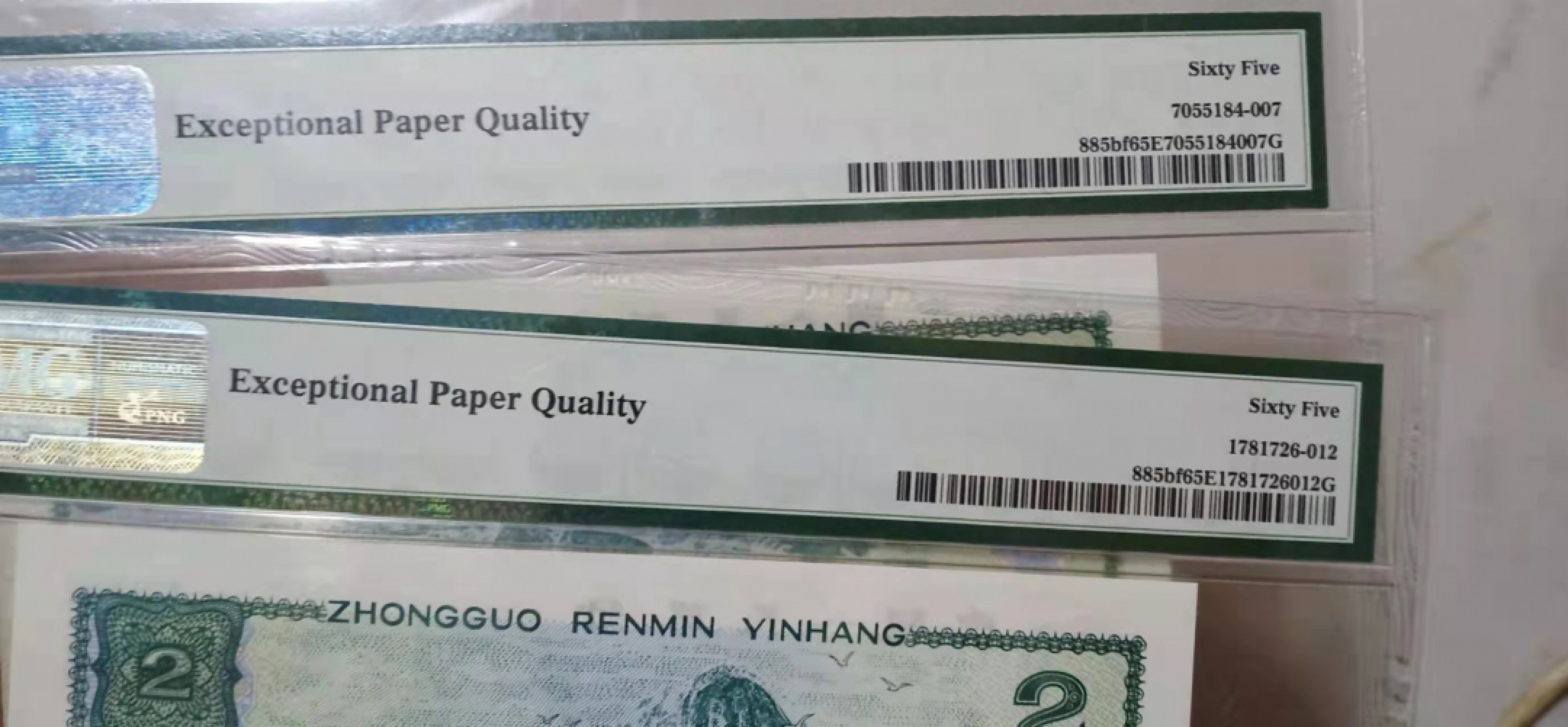 【华誉王者】1841期拍卖 美评347+无47绿幽灵中文标 PMG65E FW52066502/3 