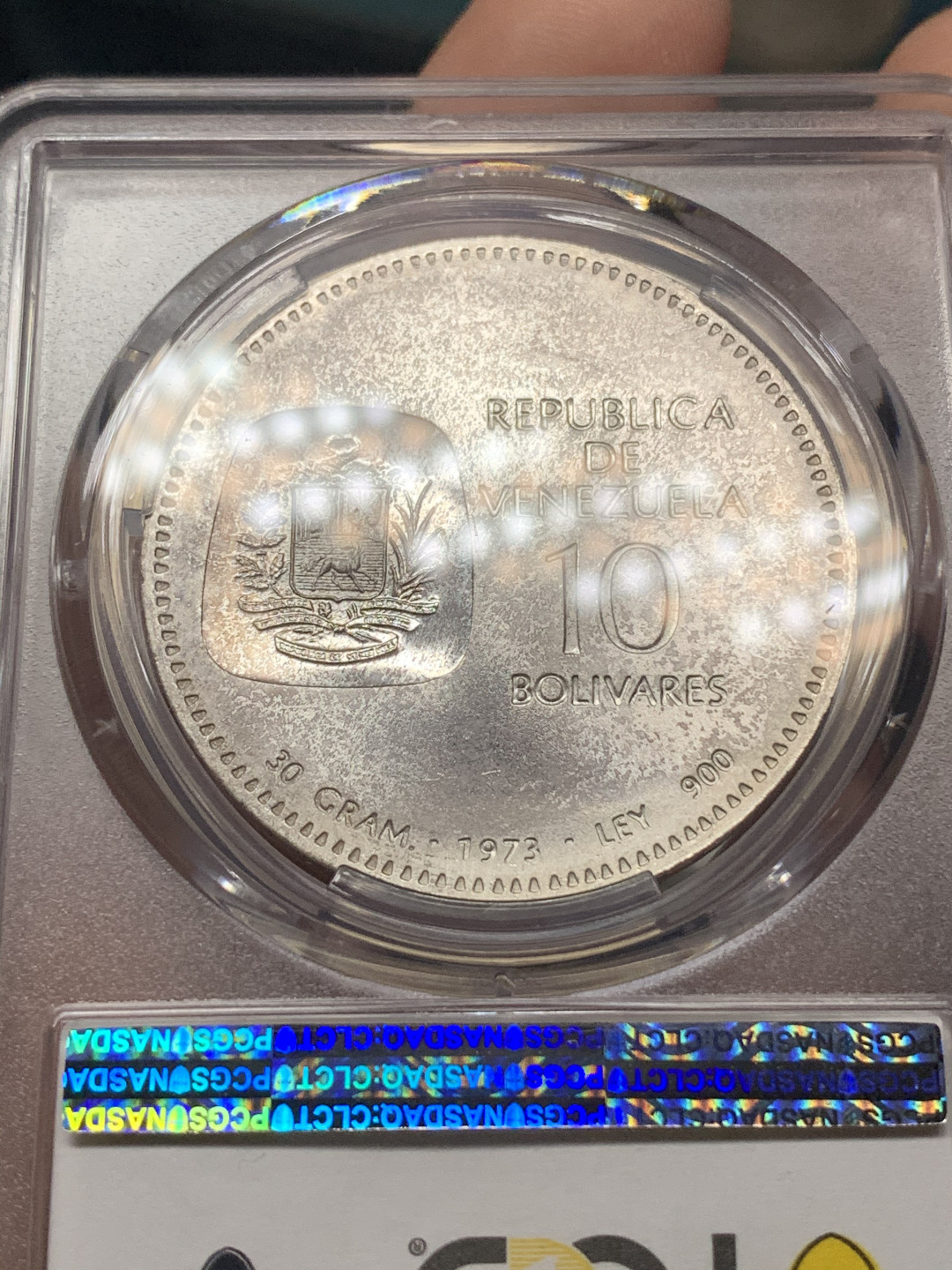 《竞宝斋》钱币微拍-第15场-本周日，周一2场连拍（全场顺丰包邮） PCGS MS63委内瑞拉1973年10玻利瓦尔独特设计西蒙玻利瓦尔100周年纪念