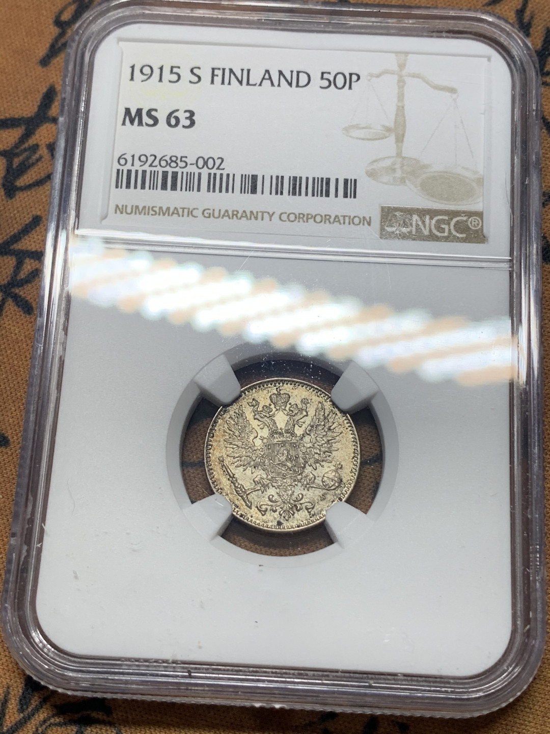 《竞宝斋》钱币微拍-第15场-本周日，周一2场连拍（全场顺丰包邮） NGC-MS63 芬兰 1915年 双头鹰 50分 银币 好品带彩包浆