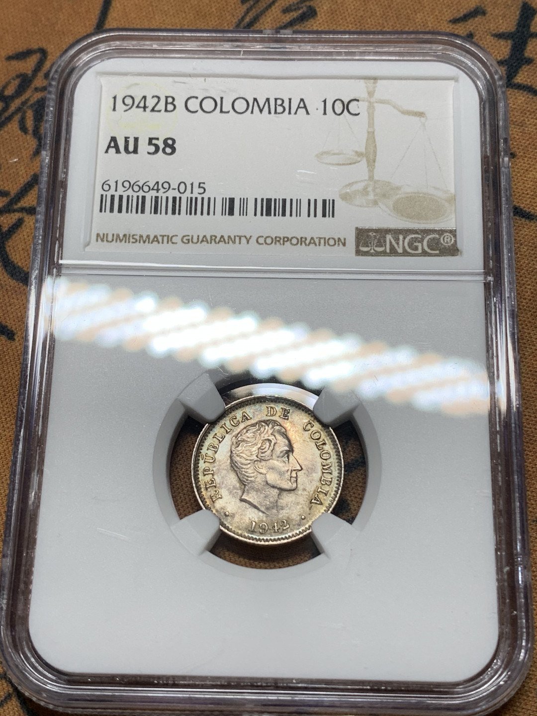 《竞宝斋》钱币微拍-第15场-本周日，周一2场连拍（全场顺丰包邮） NGC-AU58 玻利维亚 1942 年  10分 银币 小而精 细节保存的非常好